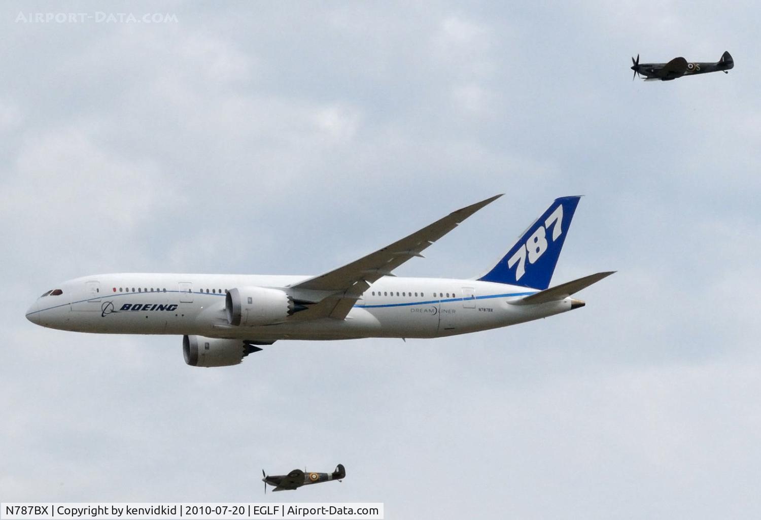 N787BX, 2010 Boeing 787-8 Dreamliner C/N 40692, Departing FIA 2010 with Spitfire escorts.