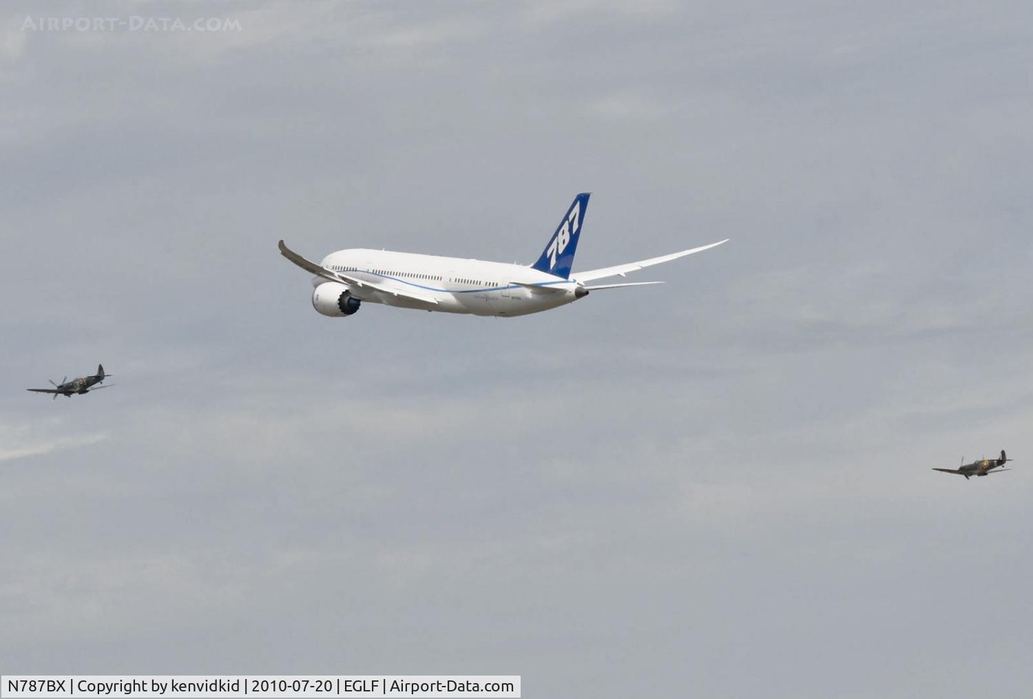 N787BX, 2010 Boeing 787-8 Dreamliner C/N 40692, Departing FIA 2010 with Spitfire escorts.