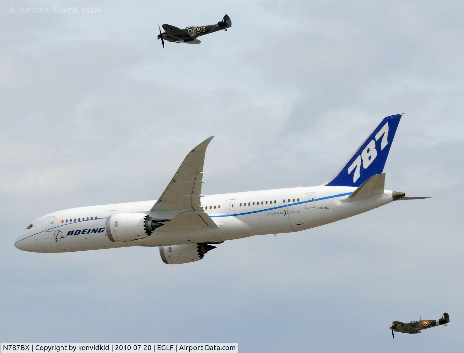 N787BX, 2010 Boeing 787-8 Dreamliner C/N 40692, Departing FIA 2010 with Spitfire escorts.