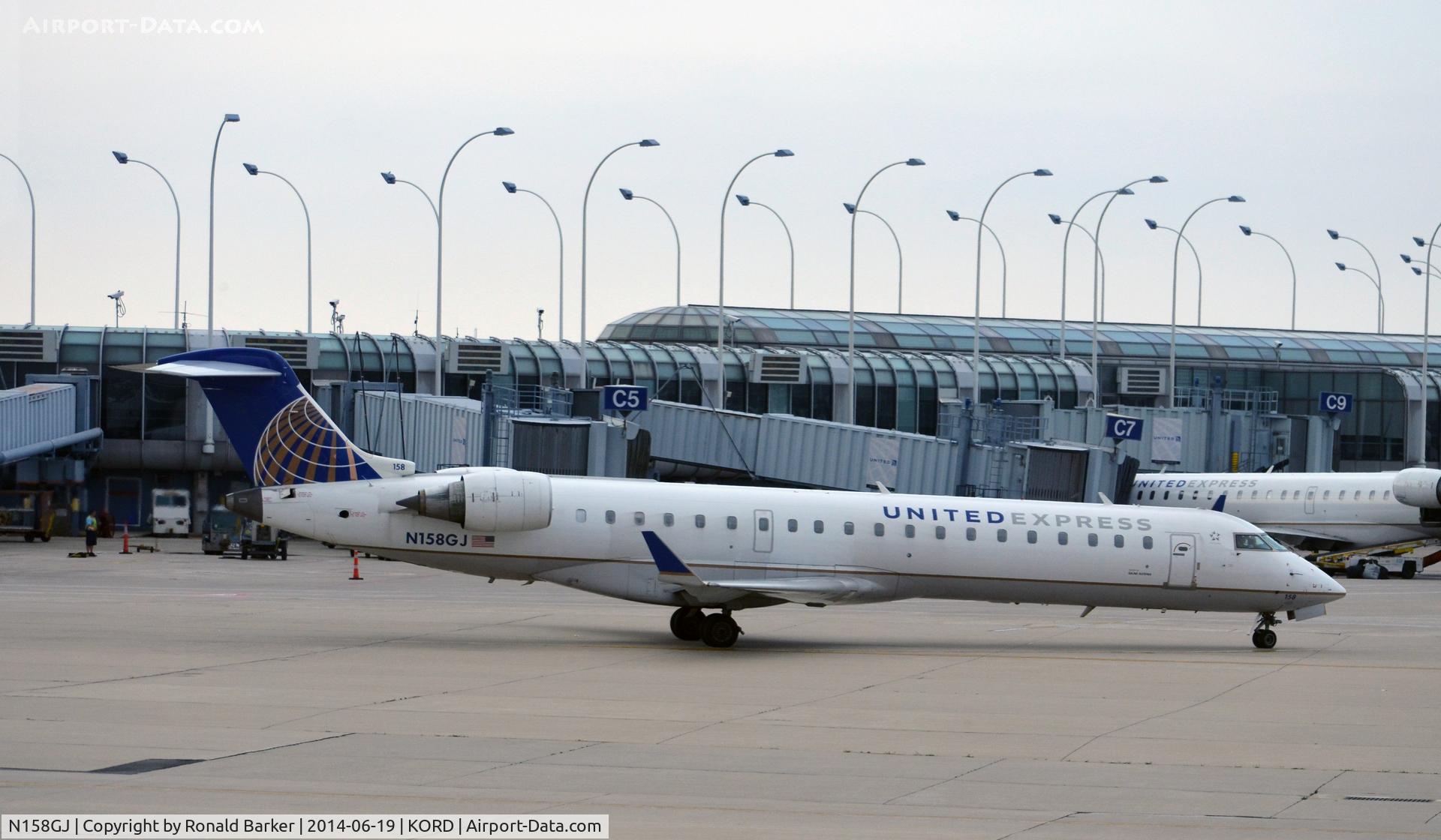 N158GJ, 2005 Bombardier CRJ-702 (CL-600-2C10) Regional Jet C/N 10237, Taxi to park  O'Hare