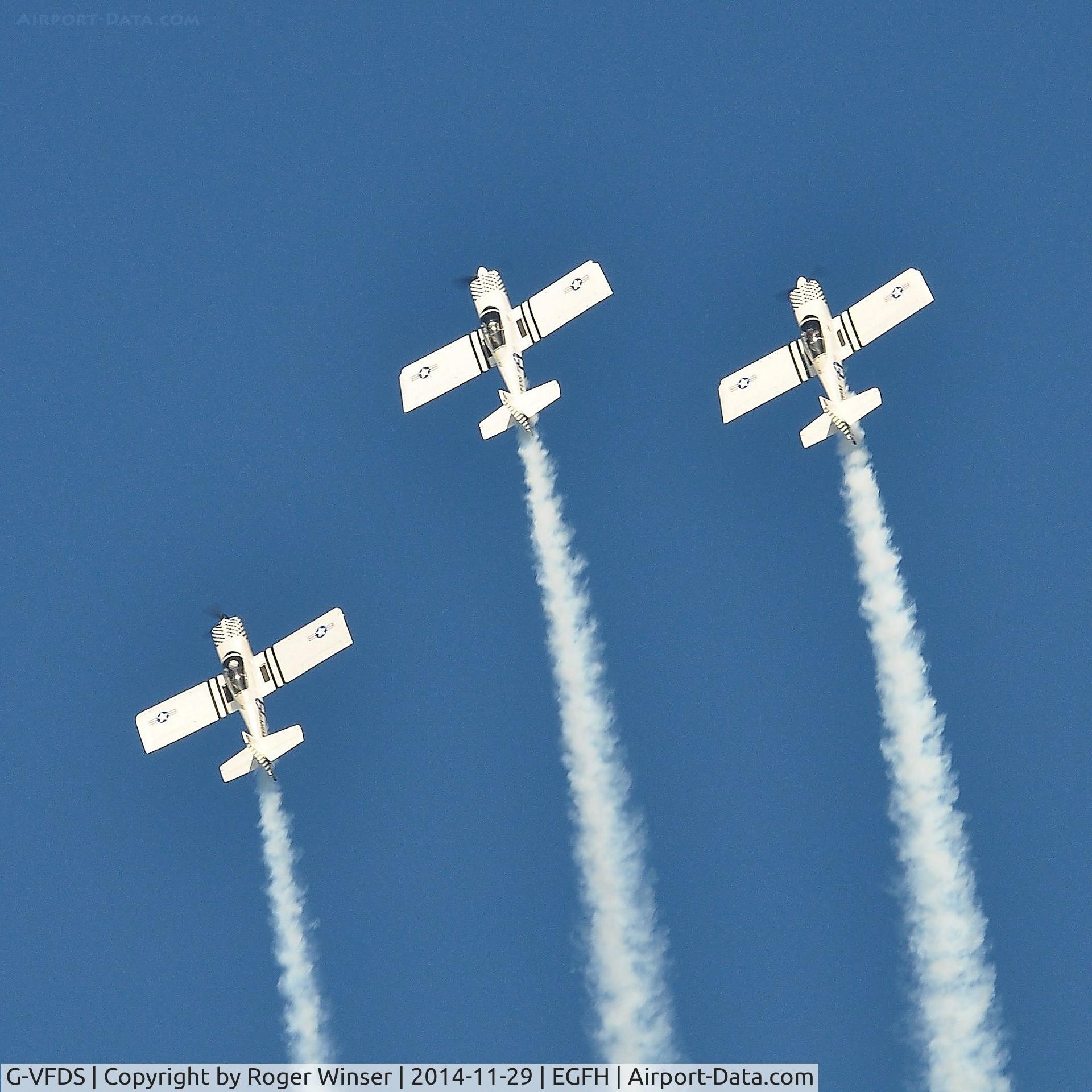 G-VFDS, 2012 Vans RV-8 C/N PFA 303-14637, G-VFDS leading Team Raven in a three-ship formation loop with G-CIBM and G-EGRV prior to returning to Swansea Airport. G-CIBM is in the number 2 slot to the right of the lead aircraft.