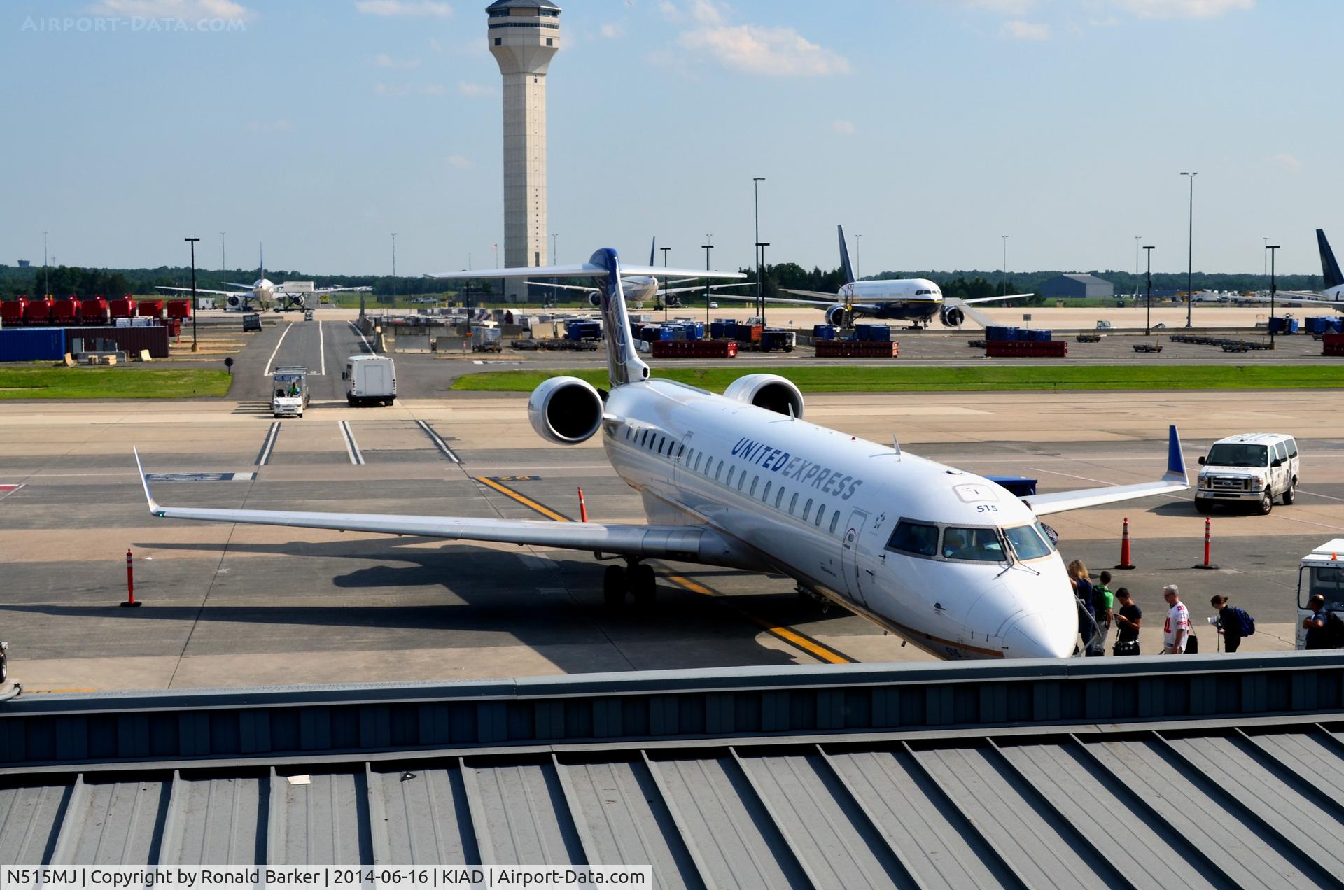 N515MJ, 2003 Bombardier CRJ-700 (CL-600-2C10) Regional Jet C/N 10117, At the gate IAD