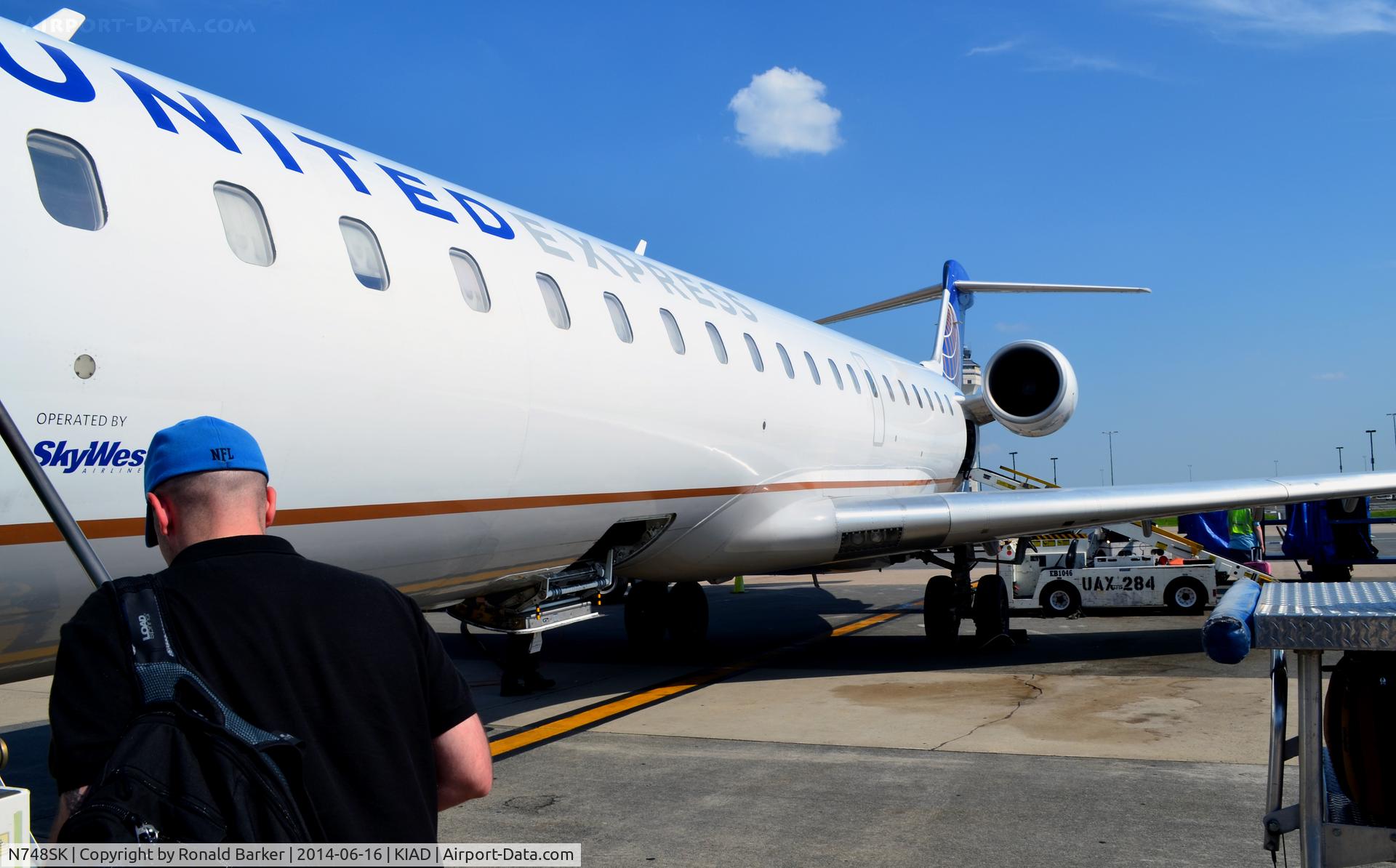 N748SK, 2005 Bombardier CRJ-700 (CL-600-2C10) Regional Jet C/N 10203, At the gate IAD