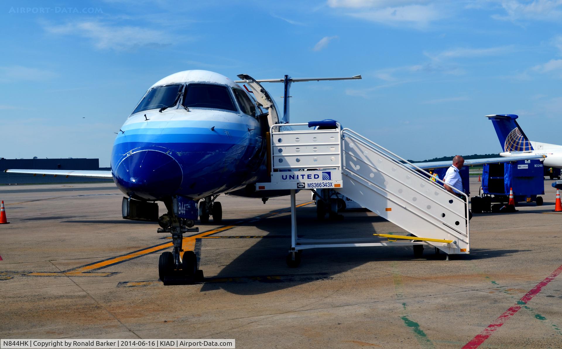 N844HK, 2004 Embraer ERJ-145LR (EMB-145LR) C/N 14500838, At the gate IAD