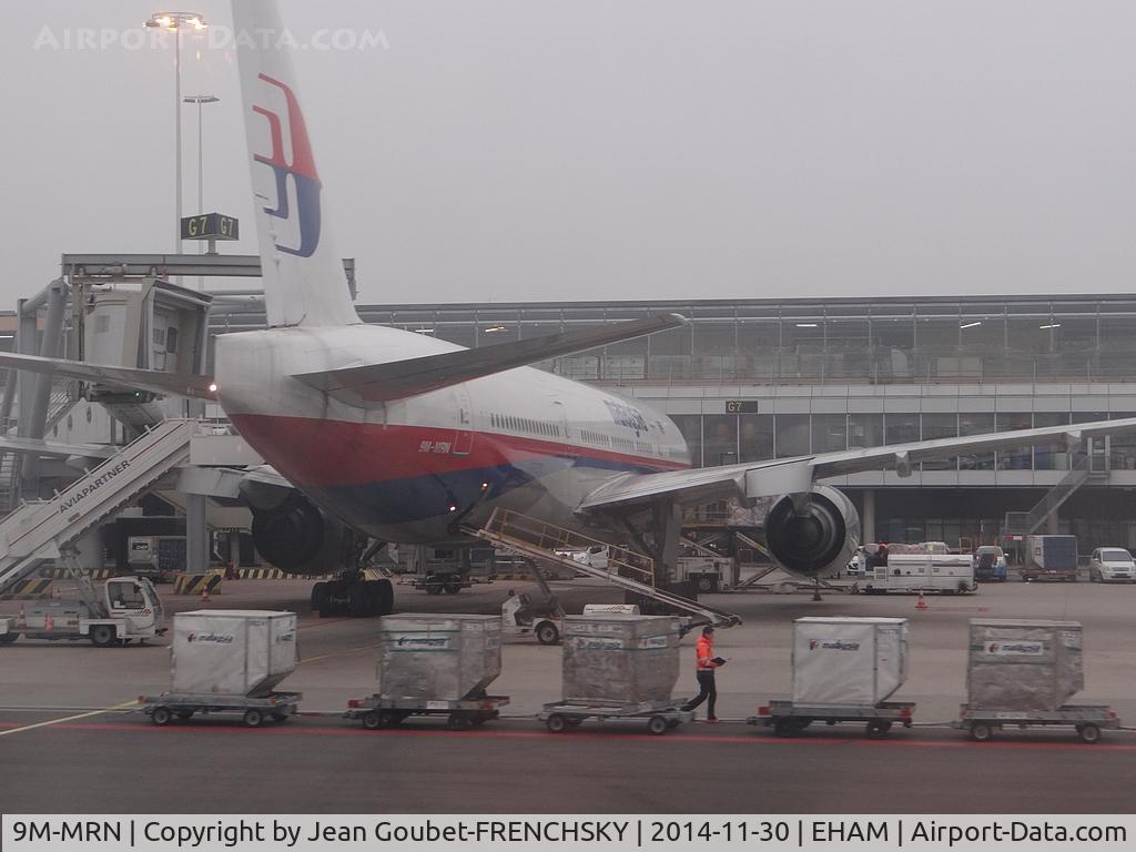 9M-MRN, 2002 Boeing 777-2H6/ER C/N 28419, MH16 parking Golf (by window'EasyJet A319)