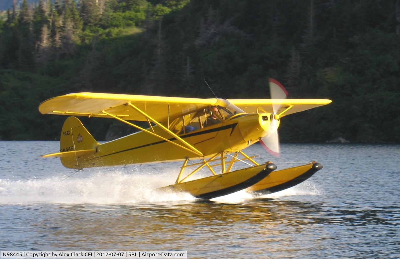 N98445, 1946 Piper J3C-65 Cub C/N 18639, This 46 J3C was originally a crop duster. She was rebuilt as a 90 horse PA-11 during 89-90.  She has an extended baggage,  a PA-11 fuel system and PA-18 trim system.  Here she sits on EDO-1400 floats.