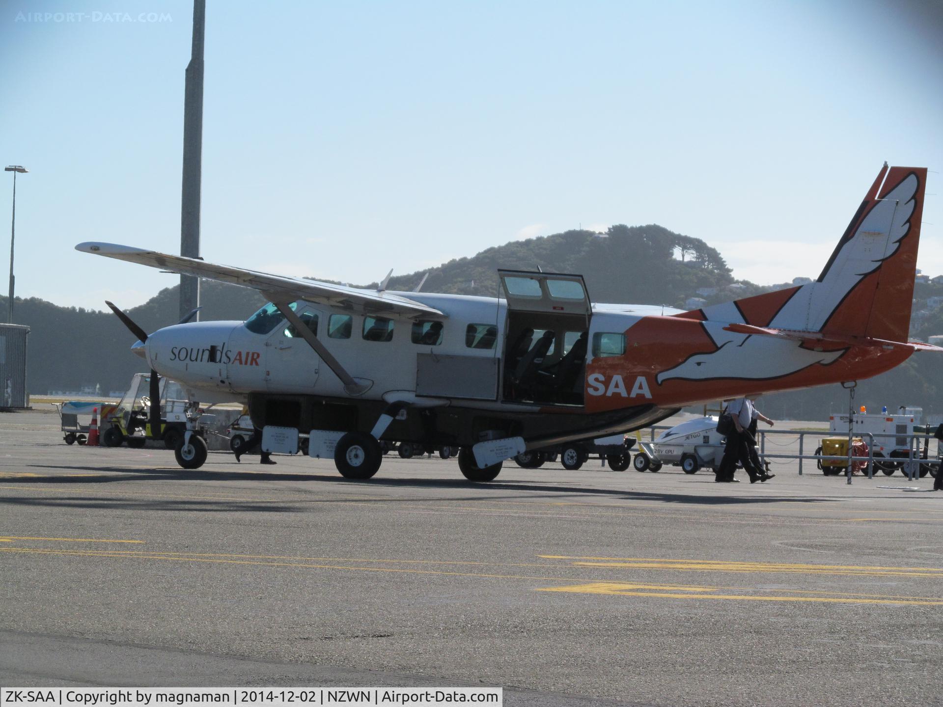 ZK-SAA, Cessna 208B Grand Caravan C/N 208B0862, shot from hire car compound hence a bit of chain link fence