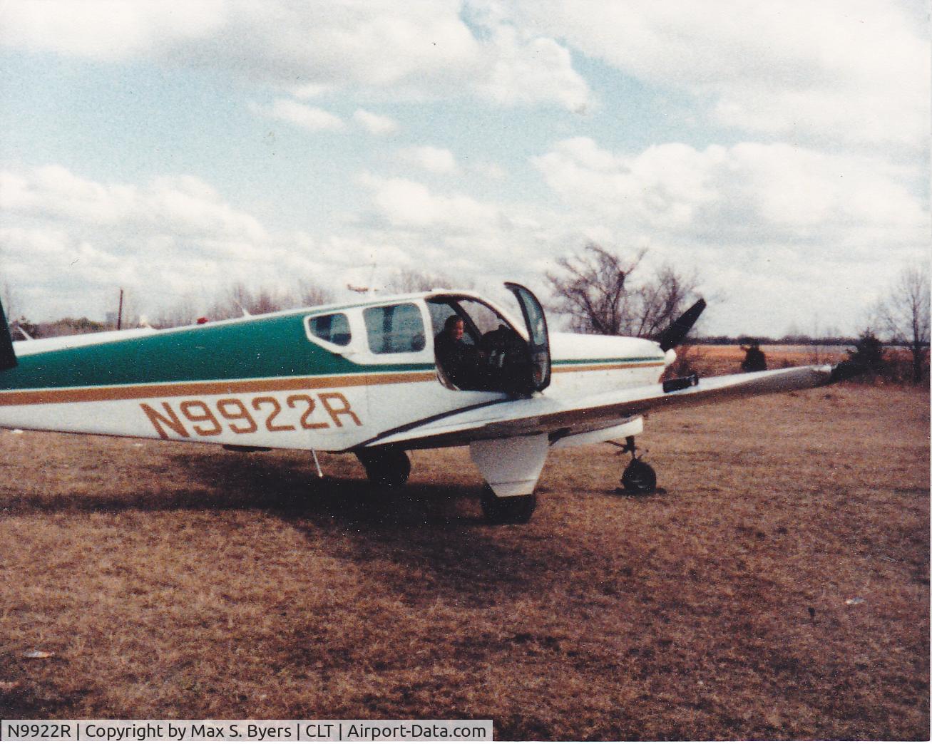 N9922R, 1960 Beech M35 Bonanza C/N D-6495, Photo taken at FBO, Douglas Municipal Airport, Charlotte, NC in March 1984.  Individual with plane is owner, Oren Z. Byers, Jr., Charlotte