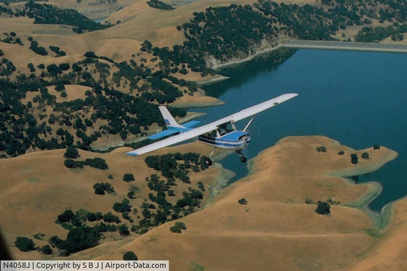 N4058J, 1966 Cessna 150G C/N 15065358, 58J over San Antonio reservoir, near Sunol,Ca. moving in for some pictures.