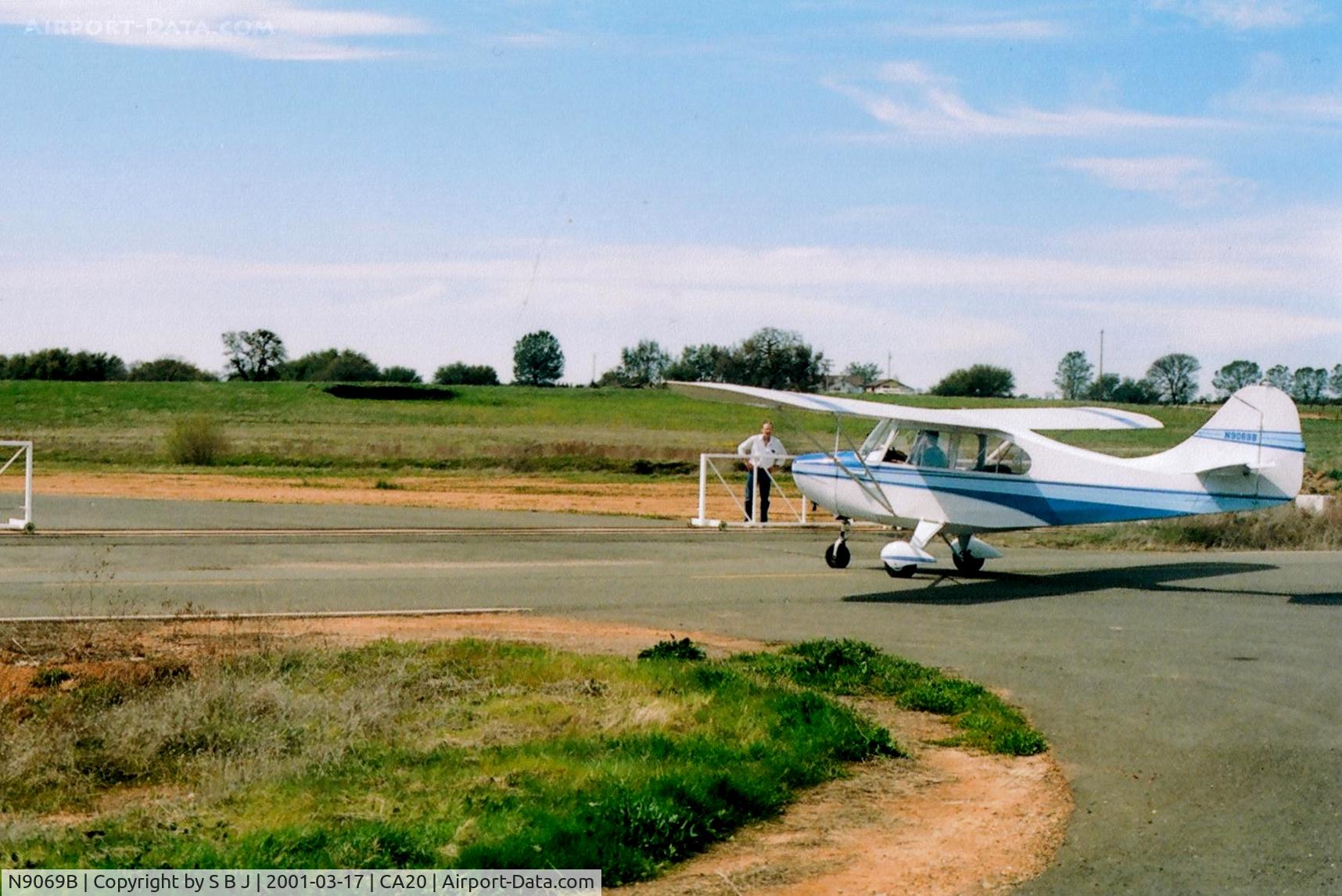 N9069B, 1958 Champion 7FC C/N 7FC-153, 69B after landing and taxying to a private residence (note gate attendant) at the exclusive Eagles Nest airport in Ione,Ca.