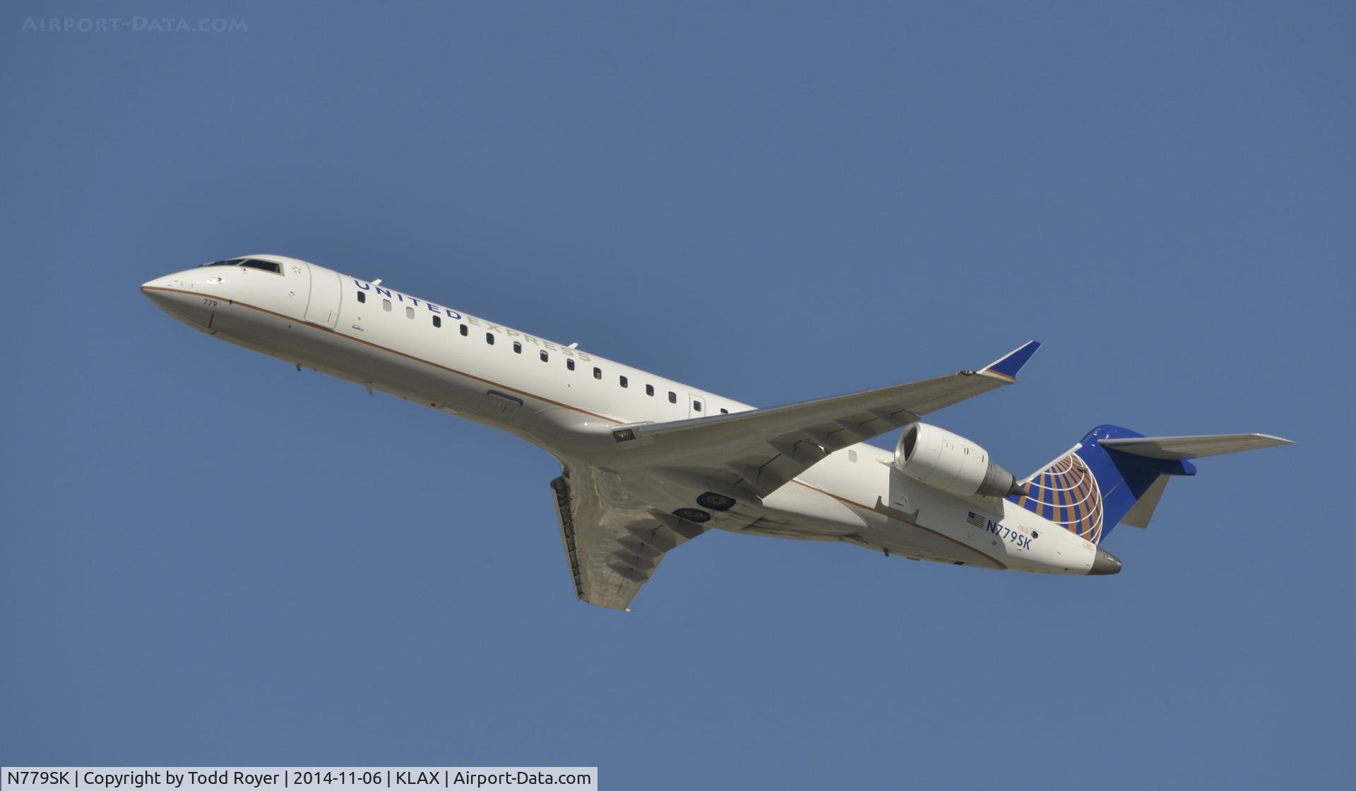 N779SK, 2009 Bombardier CRJ-702 (CL-600-2C10) Regional Jet C/N 10276, Departing LAX on 25R