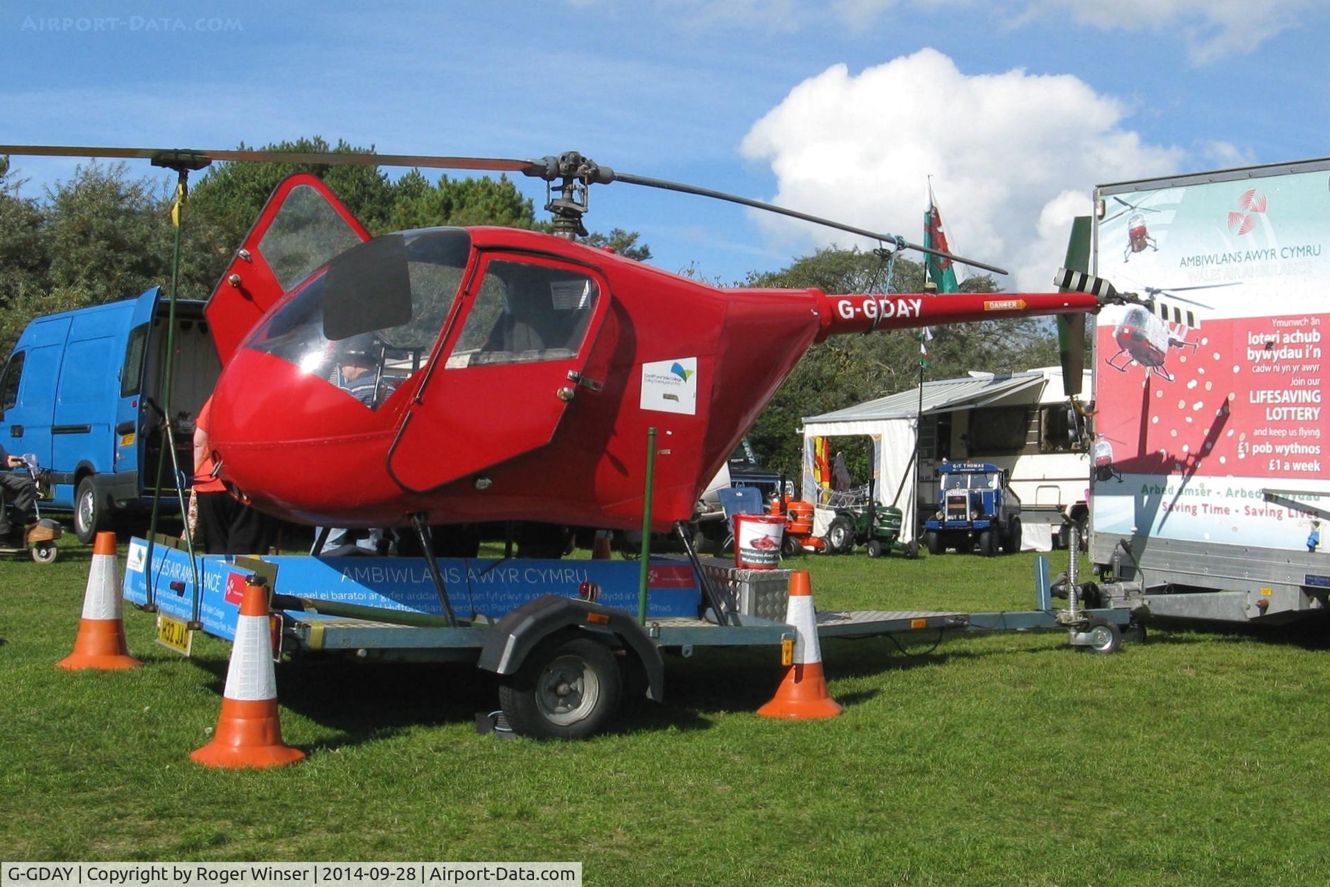 G-GDAY, 1987 Robinson R22 Beta C/N 0676, Off airport. Static helicopter used to raise funds for the charity that keeps the three Wales Air Ambulance helicopters in the air. Seen at the autumn rally held in Pembrey Country Park, Carmarthenshire, Wales, UK.