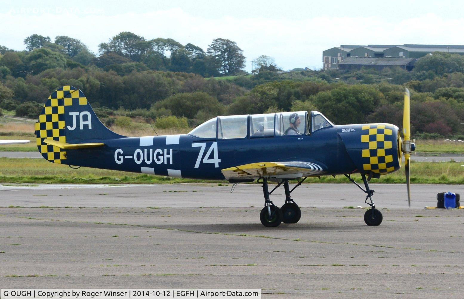 G-OUGH, 1987 Bacau Yak-52 C/N 877404, Resident Yak-52. Marked 62/IV on port side fuselage/fin.