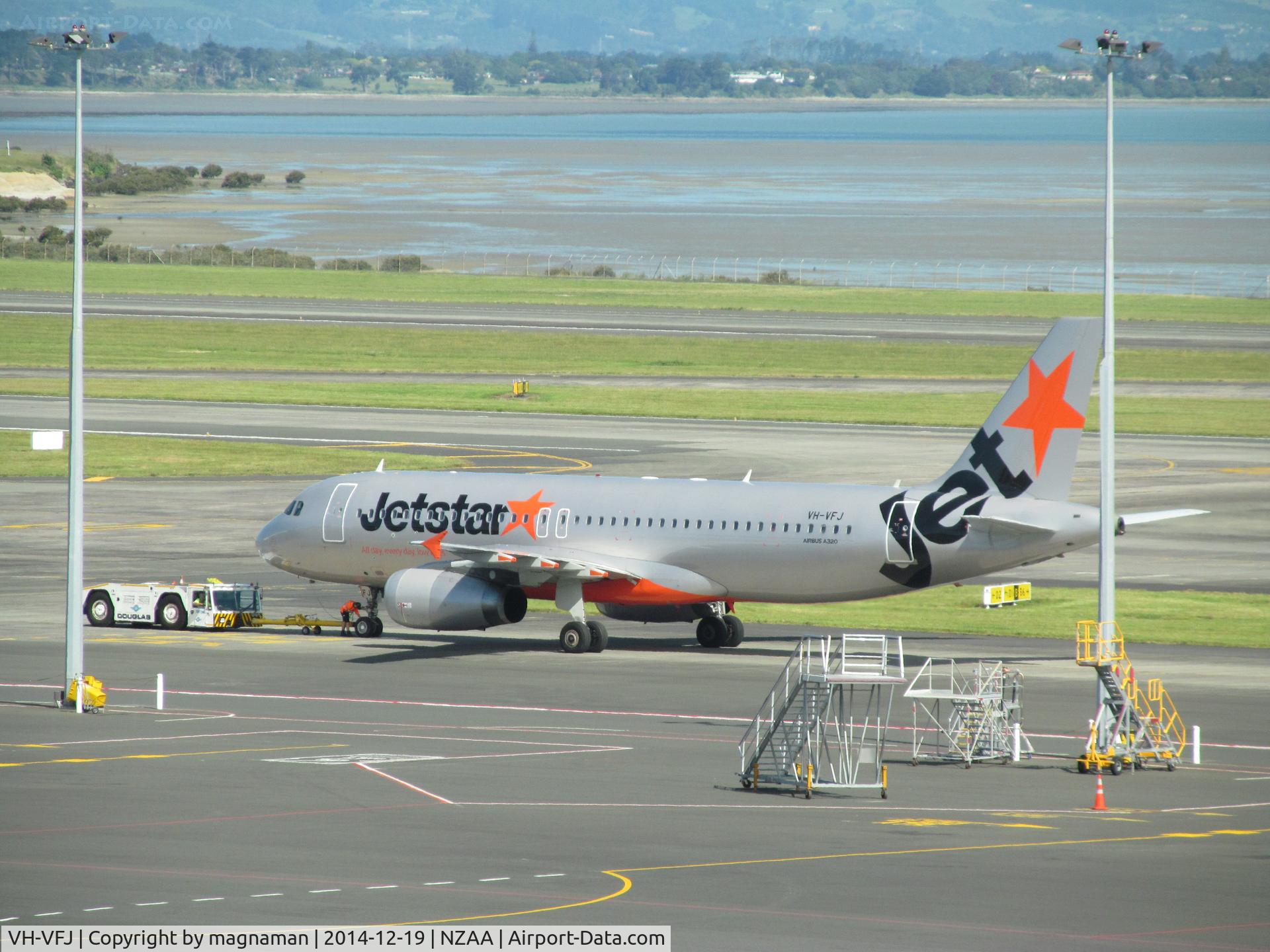 VH-VFJ, 2012 Airbus A320-232 C/N 5311, from viewing gallery through thick glass