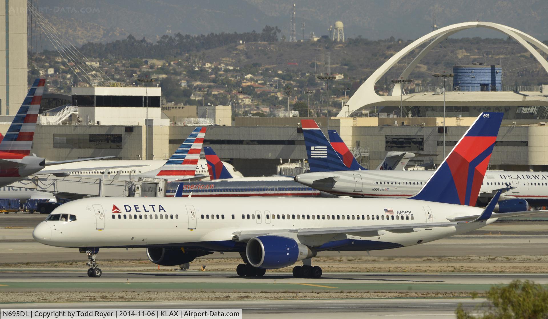 N695DL, 1998 Boeing 757-232 C/N 29727, Taxiing to gate after landing on 25L at LAX