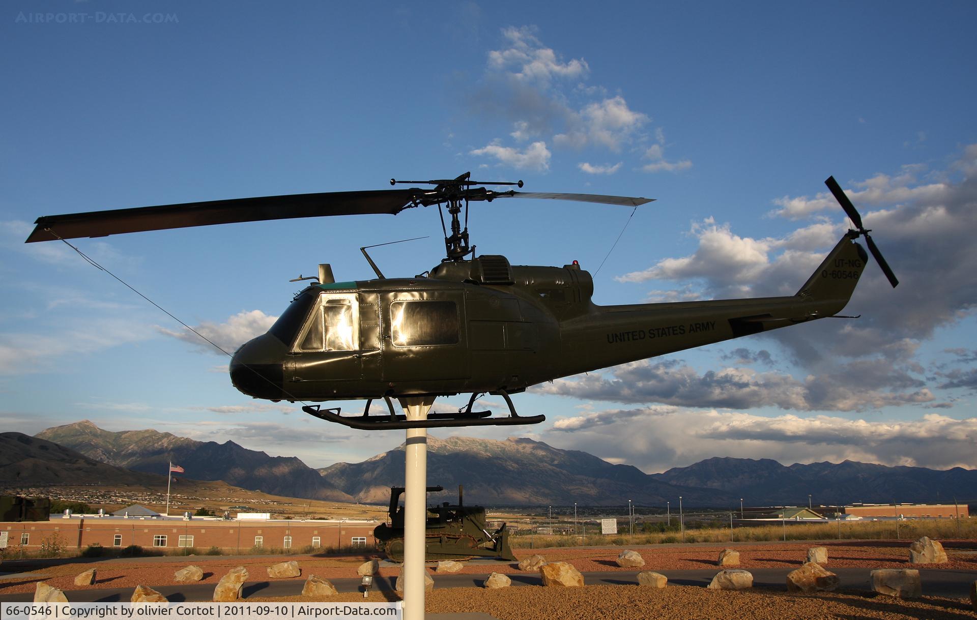 66-0546, 1966 Bell UH-1M Iroquois C/N 1528, with armored vehicules at Camp Williams