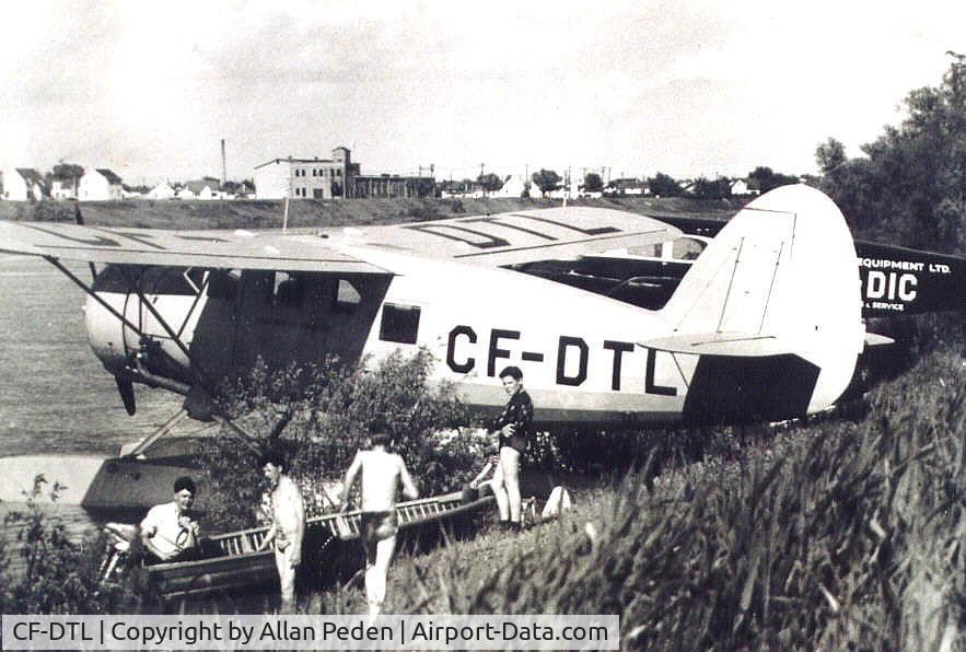 CF-DTL, 1944 Noorduyn Norseman IV C/N 57, CF-DTL    Red River (Winnipeg Manitoba) ...late 1940's out in front of Arnold Avenue.