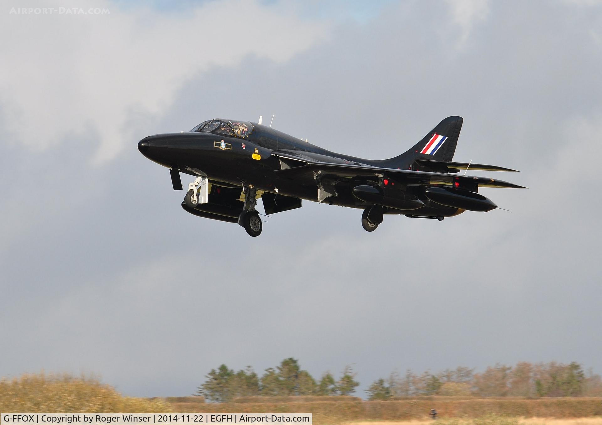 G-FFOX, 1955 Hawker Hunter T.7B C/N 41H-670792, Ex-RAF Hunter T.7A s/n WV318 now in the 'Black Arrows' scheme carried by aircraft of 111 Sqaudron RAF from 1956 to 1960. Seen pulling up after making a practice approach to Runway 22.