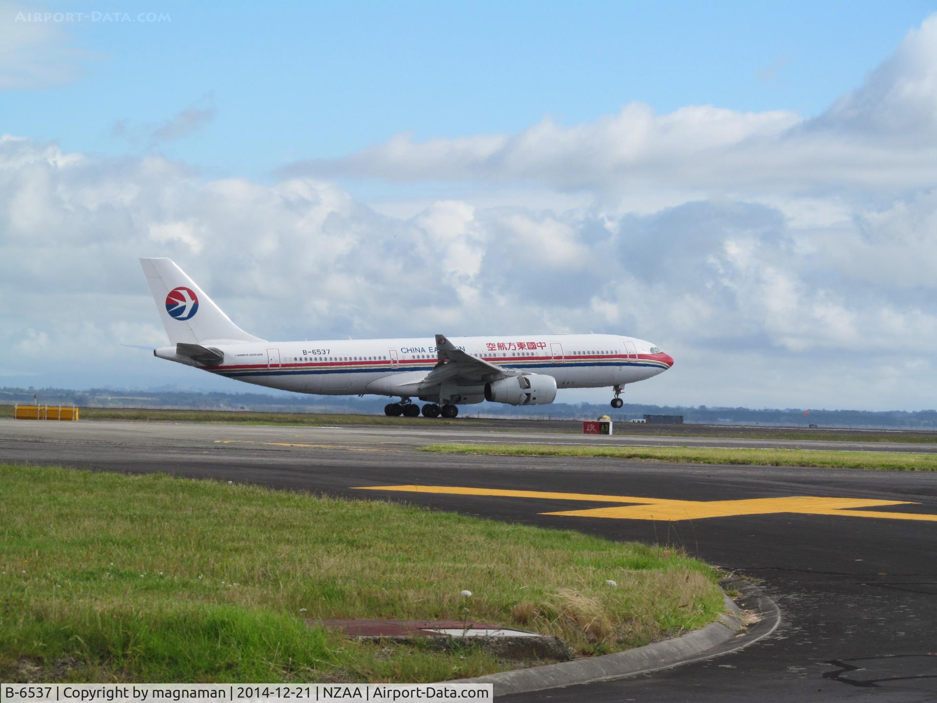 B-6537, 2011 Airbus A330-243 C/N 1262, ON runway (just) at AKL