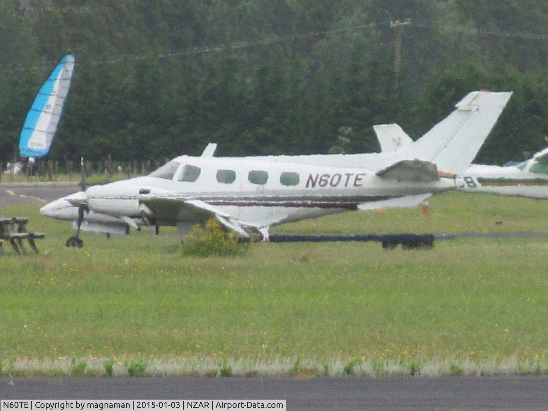 N60TE, 1976 Beech B-60 Duke C/N P-361, long heat haze view at home base of Ardmore - never seen this fly in over 3 years.