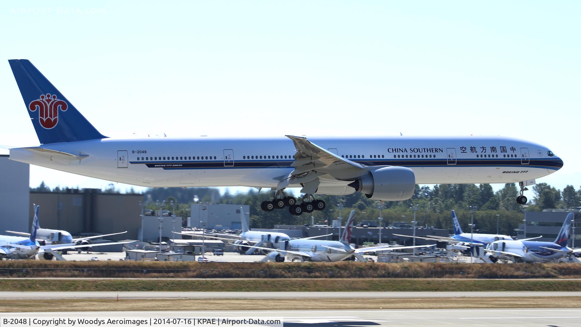 B-2048, 1914 Boeing 777-31B/ER C/N 43220, Arriving on 16R after a test flight.