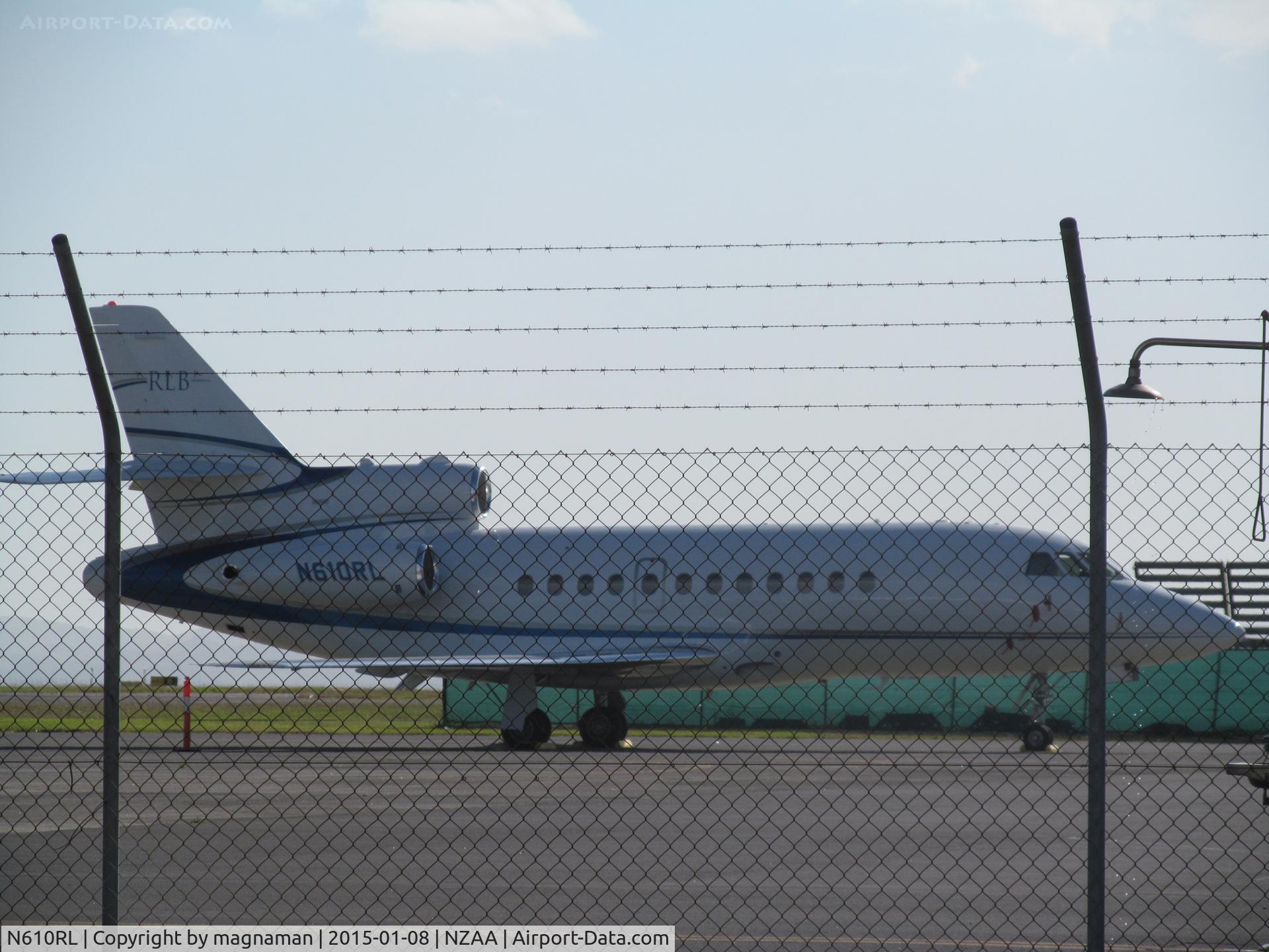 N610RL, 1988 Dassault Falcon 900 C/N 68, Shame about the double fence line between road and temp parking area.