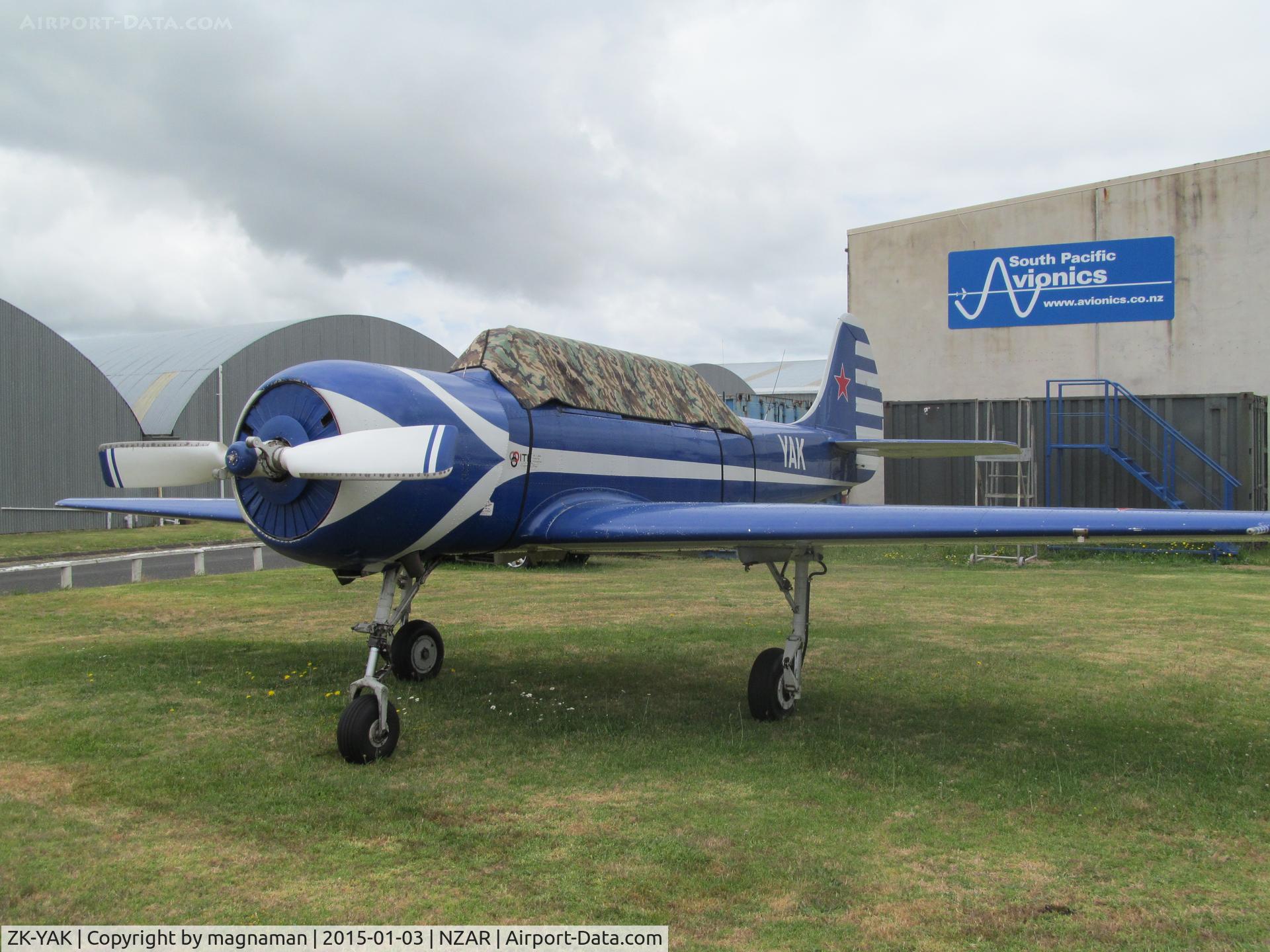 ZK-YAK, Yakovlev Yak-52 C/N 9712002, on grass at ardmore