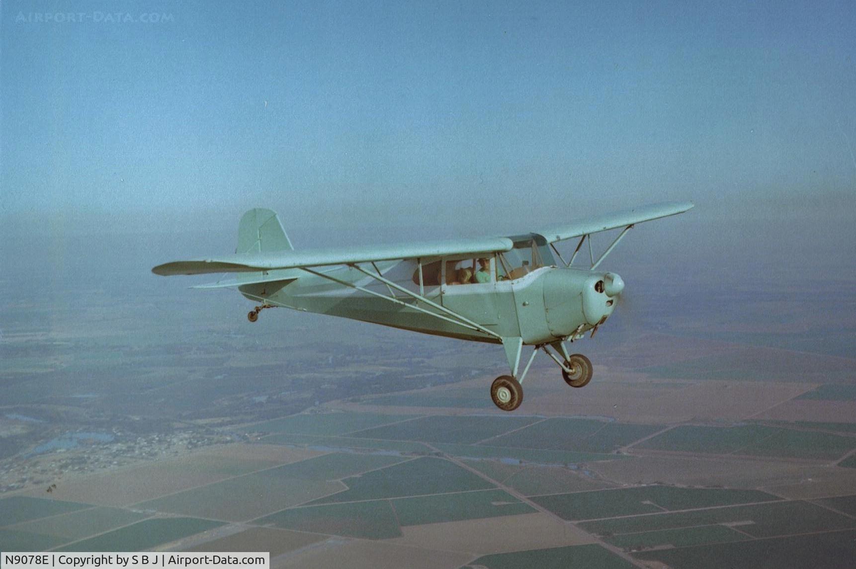 N9078E, 1946 Aeronca 11AC Chief C/N 11AC-710, 78E as it flys over 1Q4 near Tracy,Ca. around 1977-78. 78E is being superbly flown by future Northwest 747 Captain Wes.