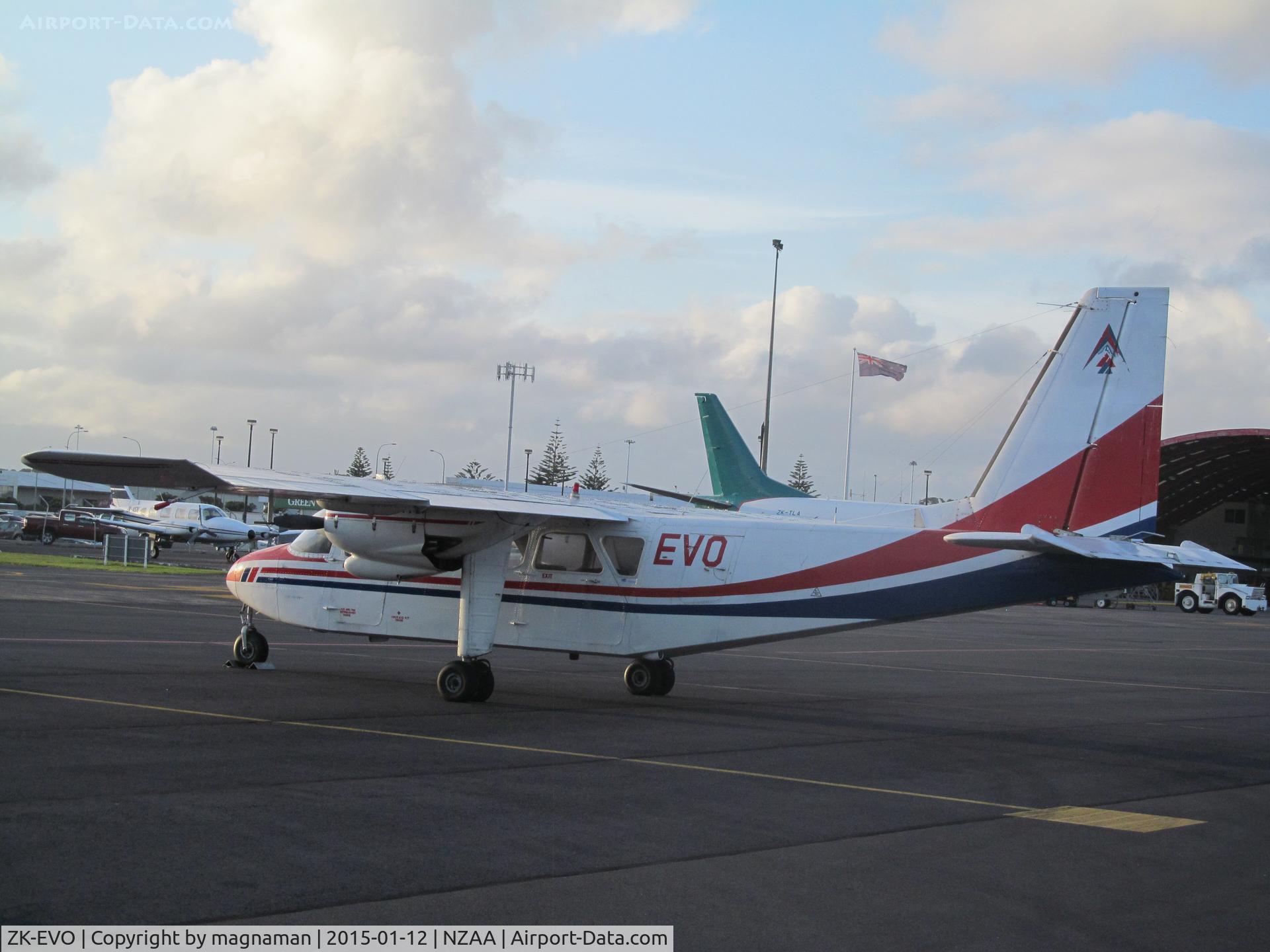 ZK-EVO, 1976 Britten-Norman BN-2A-26 Islander C/N 785, looking over fence from Air NZ car park