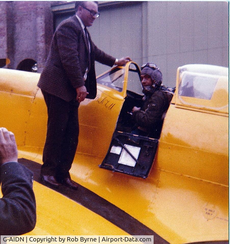 G-AIDN, 1944 Supermarine 502 Spitfire TR.8 (LF.VIIIc) C/N 6S/729058, Bern Byrne assisting pilot / owner John Fairey at Andover Airfield 1974
