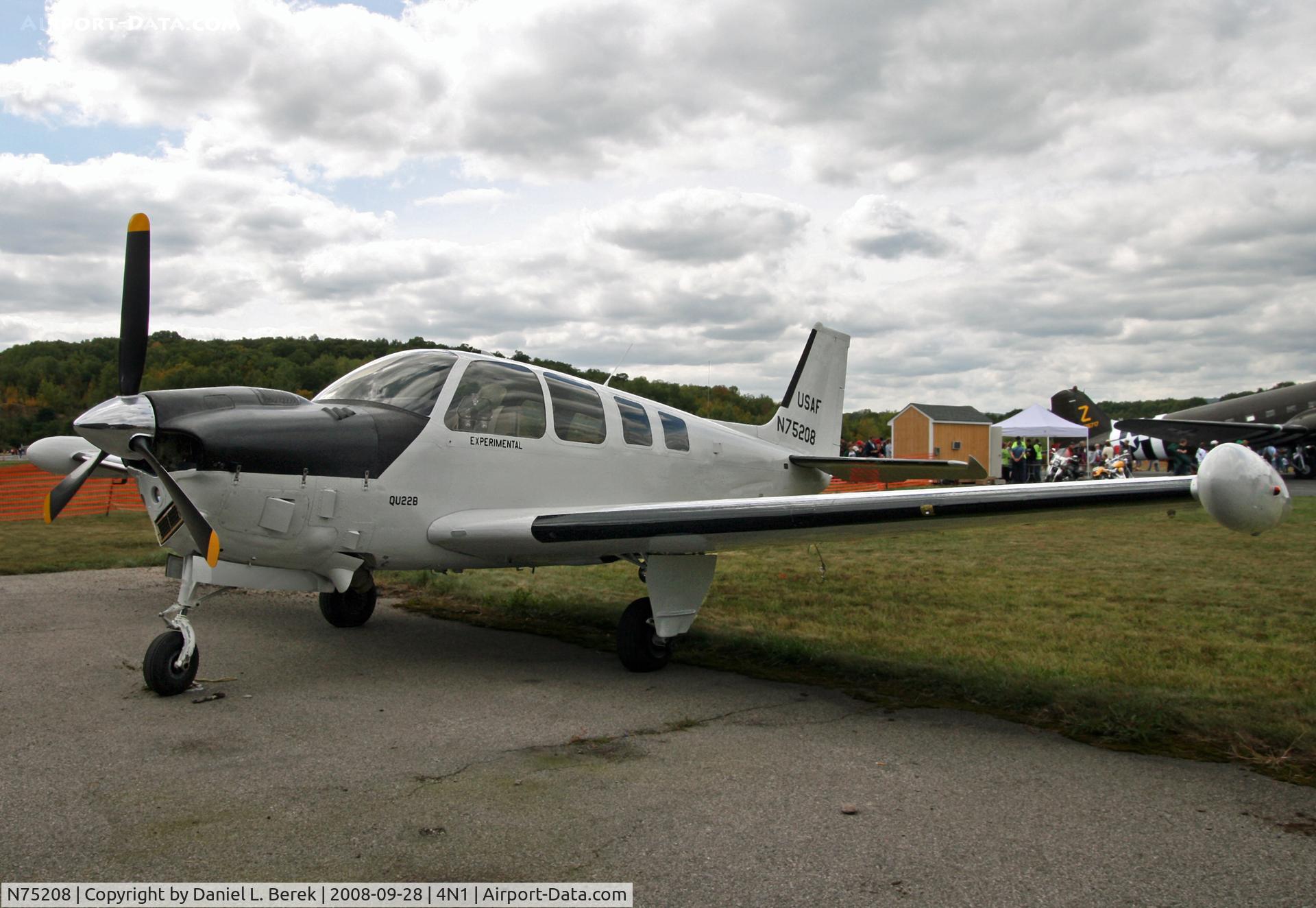 N75208, 1969 Beech QU-22B C/N EB-12, A civilianized Air Force veteran enjoys an airshow at Greenwood Lake Airport, NJ.
