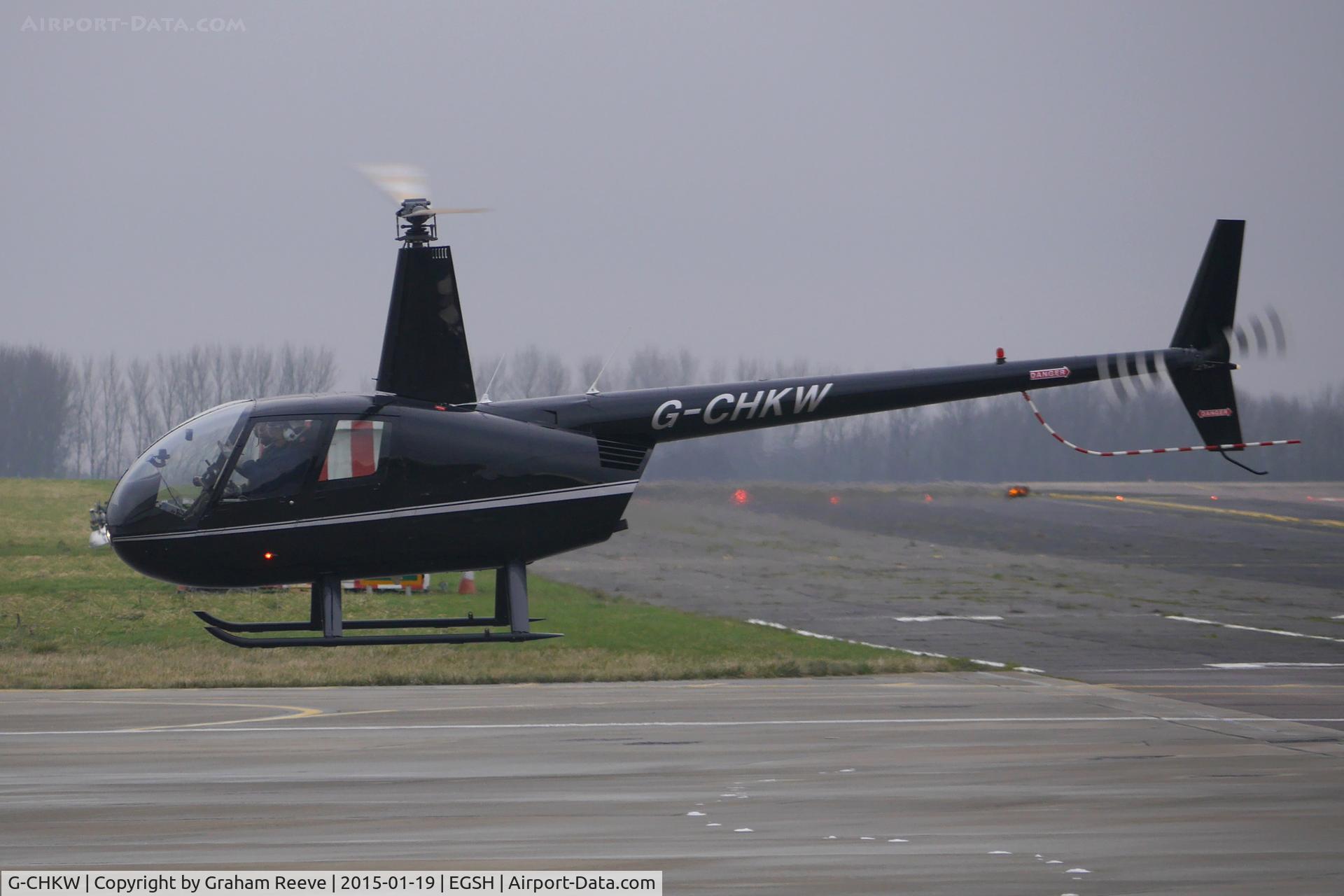 G-CHKW, 2005 Robinson R44 Raven I C/N 1504, About to hover taxi to runway 