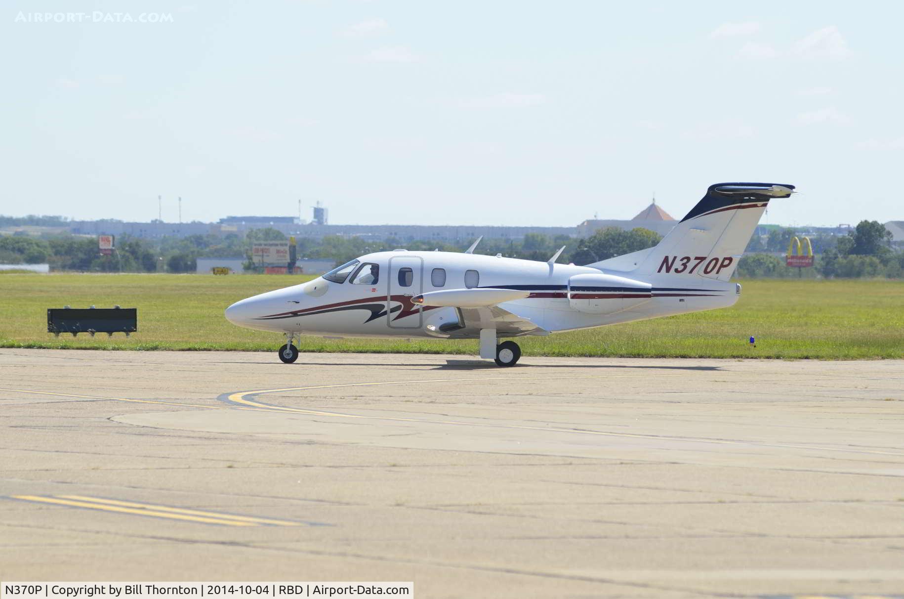N370P, 2007 Eclipse Aviation Corp EA500 C/N 000066, The pilot of an Eclipse Aviation Corp EA500 taxis to parking @Dallas Executive Airport (Redbird). The EA500 is a twin 6-place jet aircraft built in 2007, powered by 2 P&W PW610F-A Turbofan engines. (An f-Stop 5.6 Photography Photo by Bill Thornton)