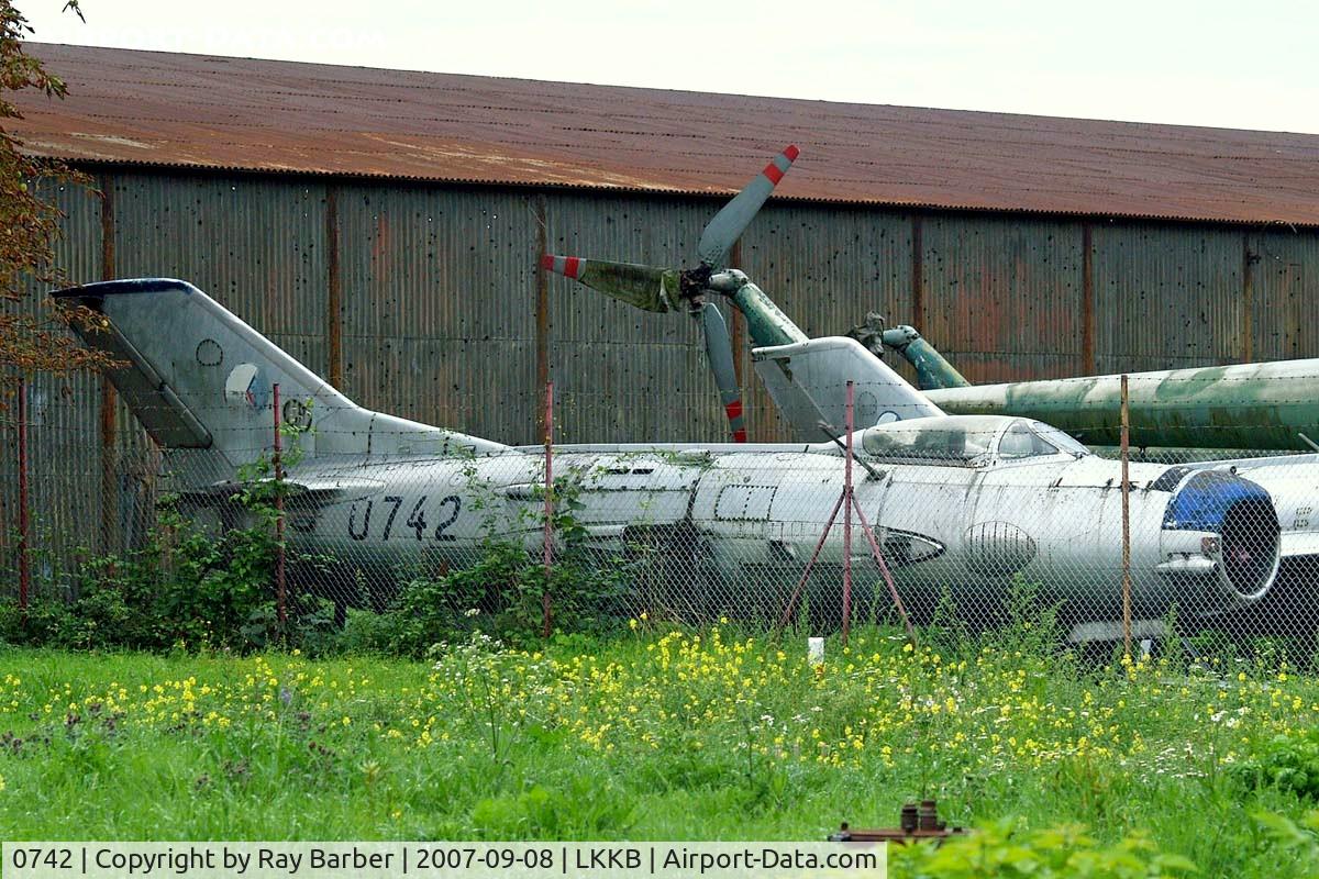 0742, Mikoyan-Gurevich MiG-19P C/N 650742, Mikoyan-Gurevich MiG-19P Farmer [650742] (Czech Air Force) Prague-Kbely~OK. Behind fence in storage compound.