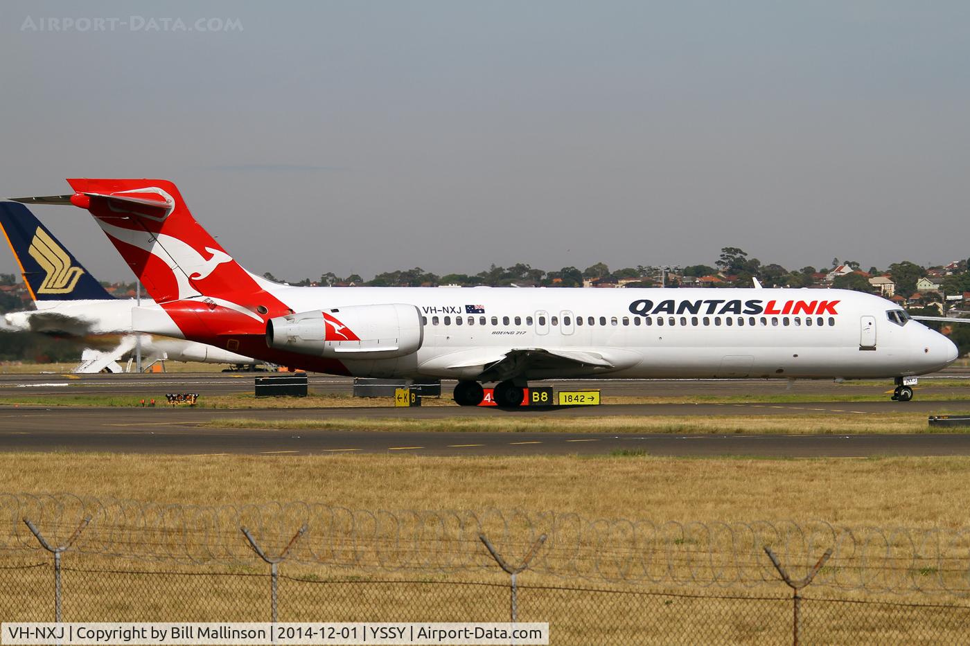 VH-NXJ, 2003 Boeing 717-200 C/N 55166, TAXIING FROM 34L