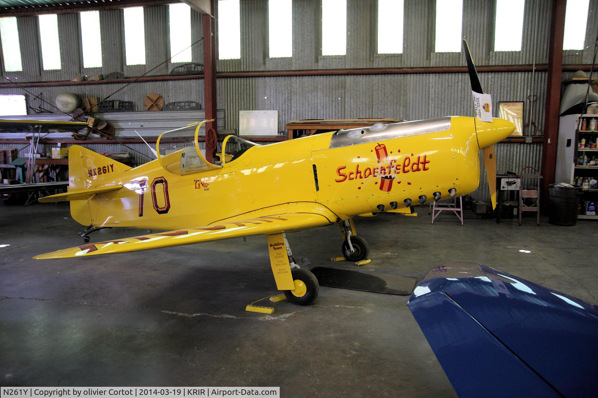 N261Y, 2004 Schoenfeldt Firecracker Replica C/N R-4-261, inside a hangar of Flabob airport