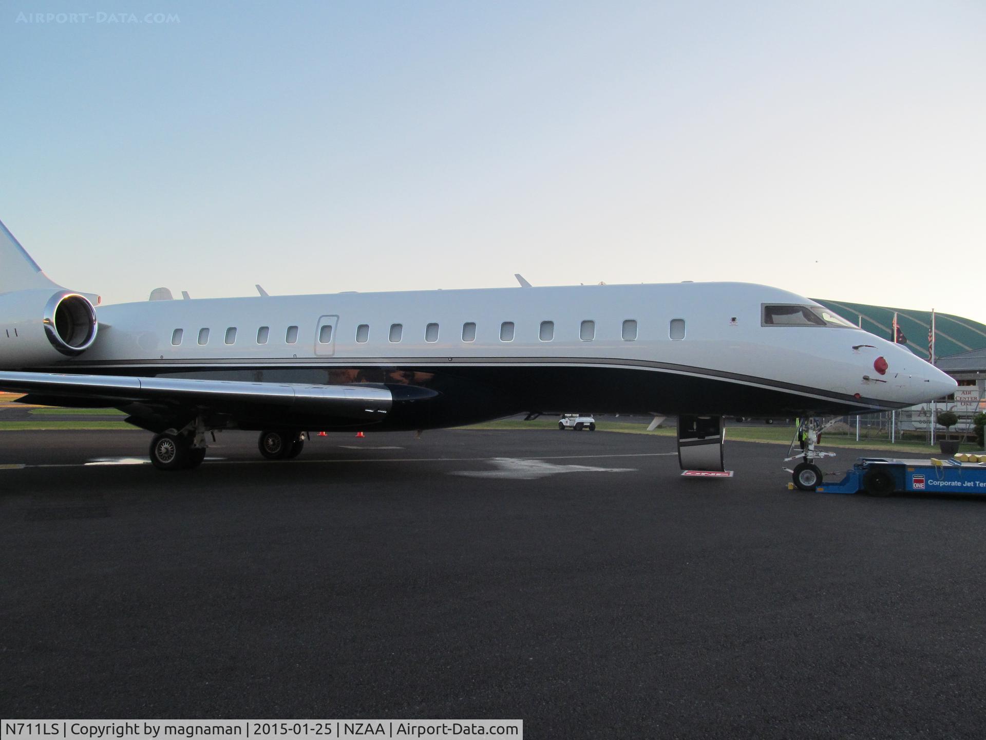 N711LS, 2012 Bombardier BD-700-1A10 Global 6000 C/N 9476, RIGHT NEXT TO FENCE - need wide angle lens