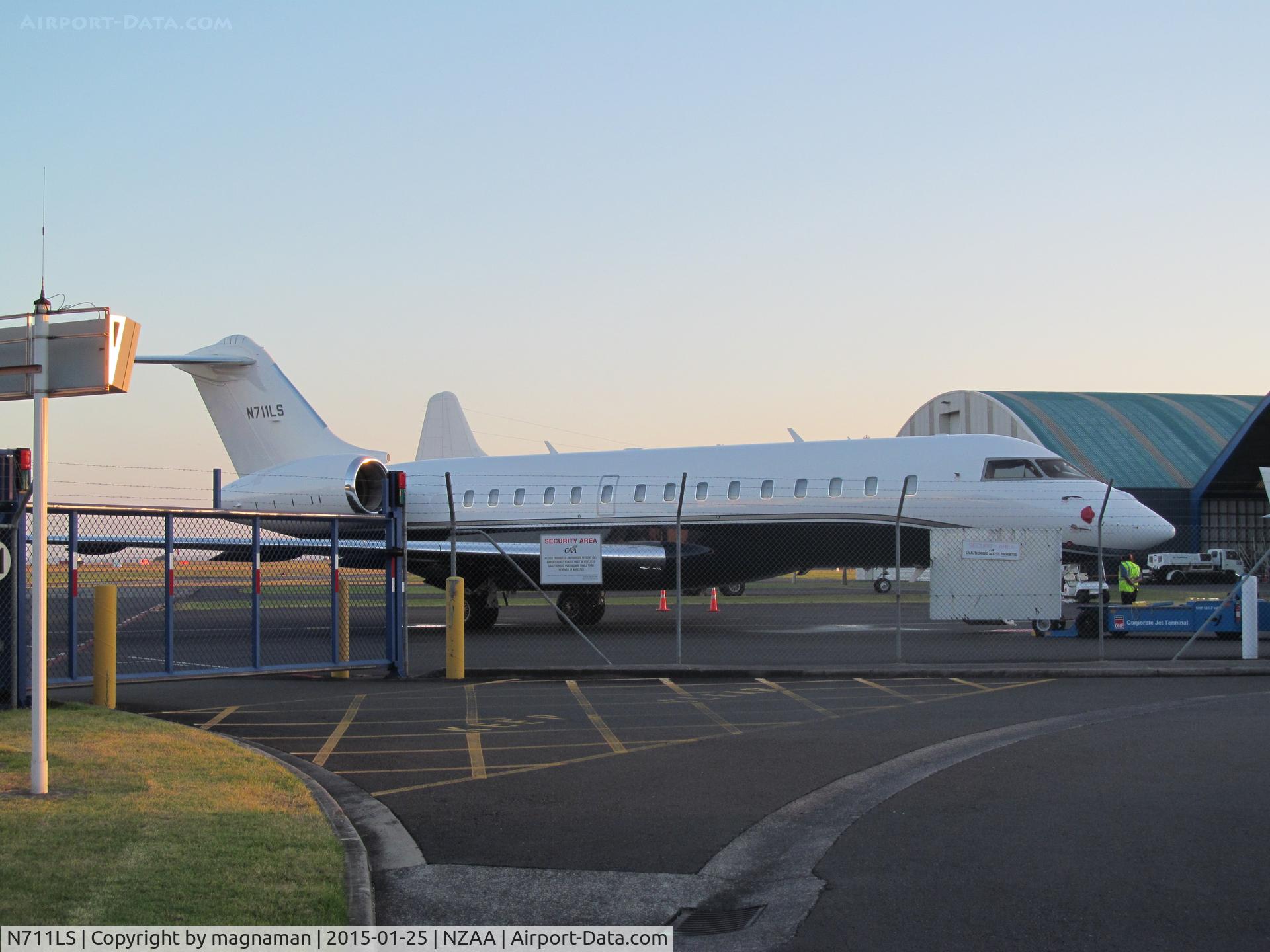 N711LS, 2012 Bombardier BD-700-1A10 Global 6000 C/N 9476, shame about fence - but parked too close