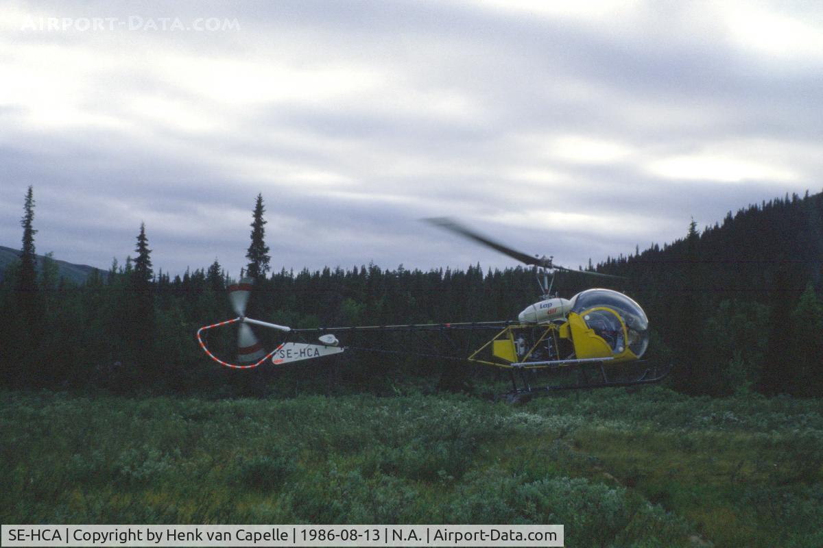 SE-HCA, Bell 47G-2 C/N 1492, Bell 47 taking off from a clearing in the forest at Pårtestugorna (mountain hut) near Kvikkjokk in Swedish Lappland.