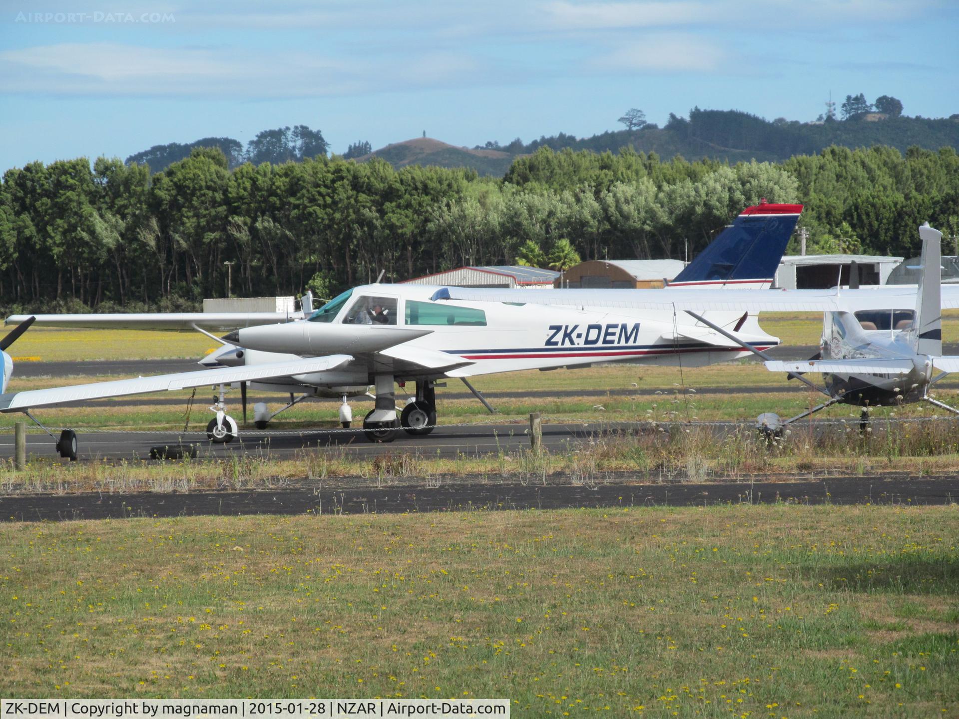 ZK-DEM, 1973 Cessna 310Q C/N 310Q0765, taxying between parked planes for aerial survey work