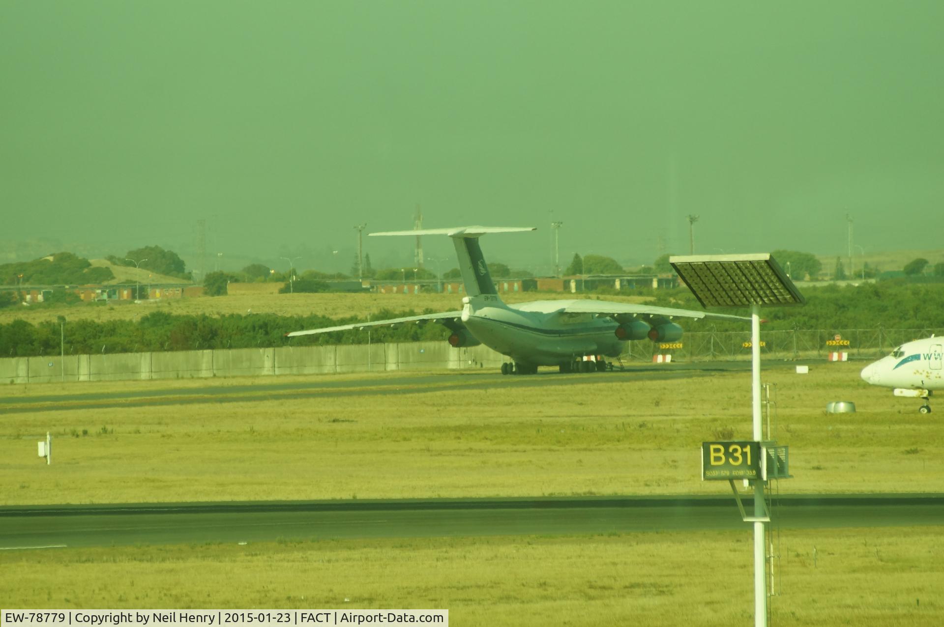 EW-78779, 1988 Ilyushin Il-76TD C/N 0083489662, Rear view of parked-up EW-78779 @ Cape Town - taken from CPT Terminal departure lounge.