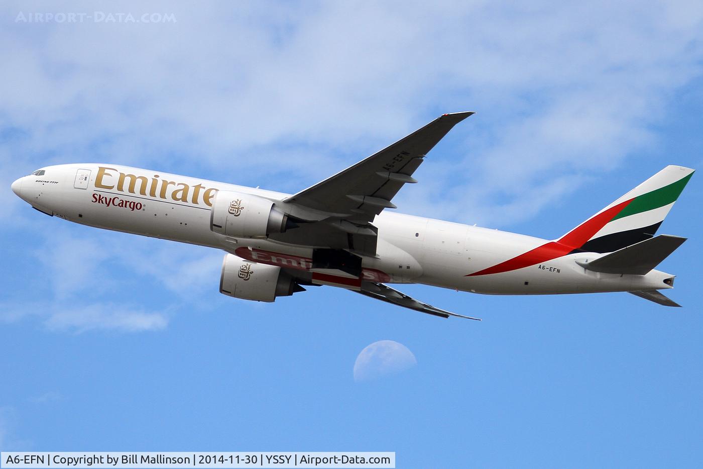 A6-EFN, 2014 Boeing 777-F1H C/N 42232, away from 34L