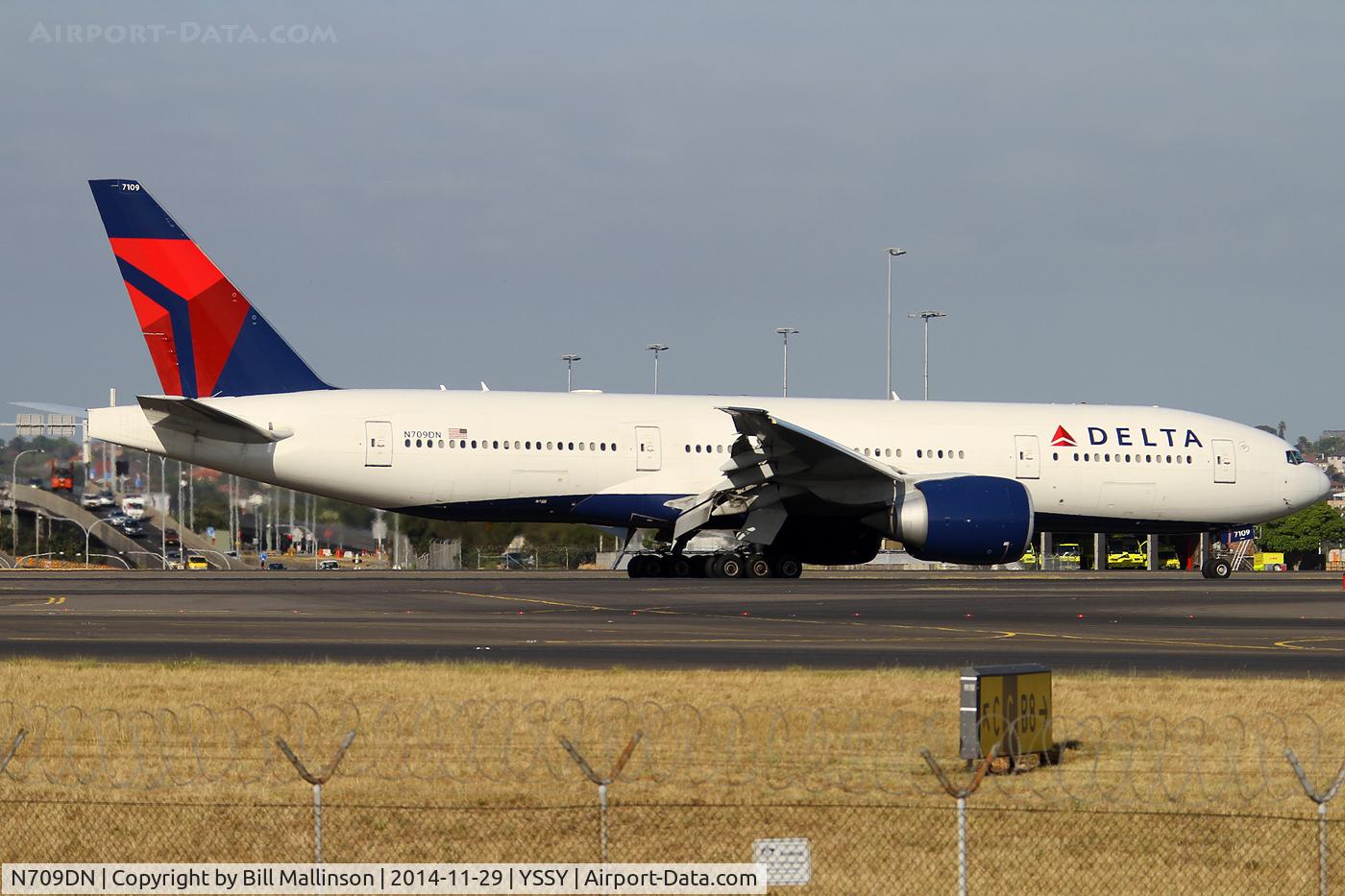N709DN, 2010 Boeing 777-232/LR C/N 40559, taxiing from 34L
