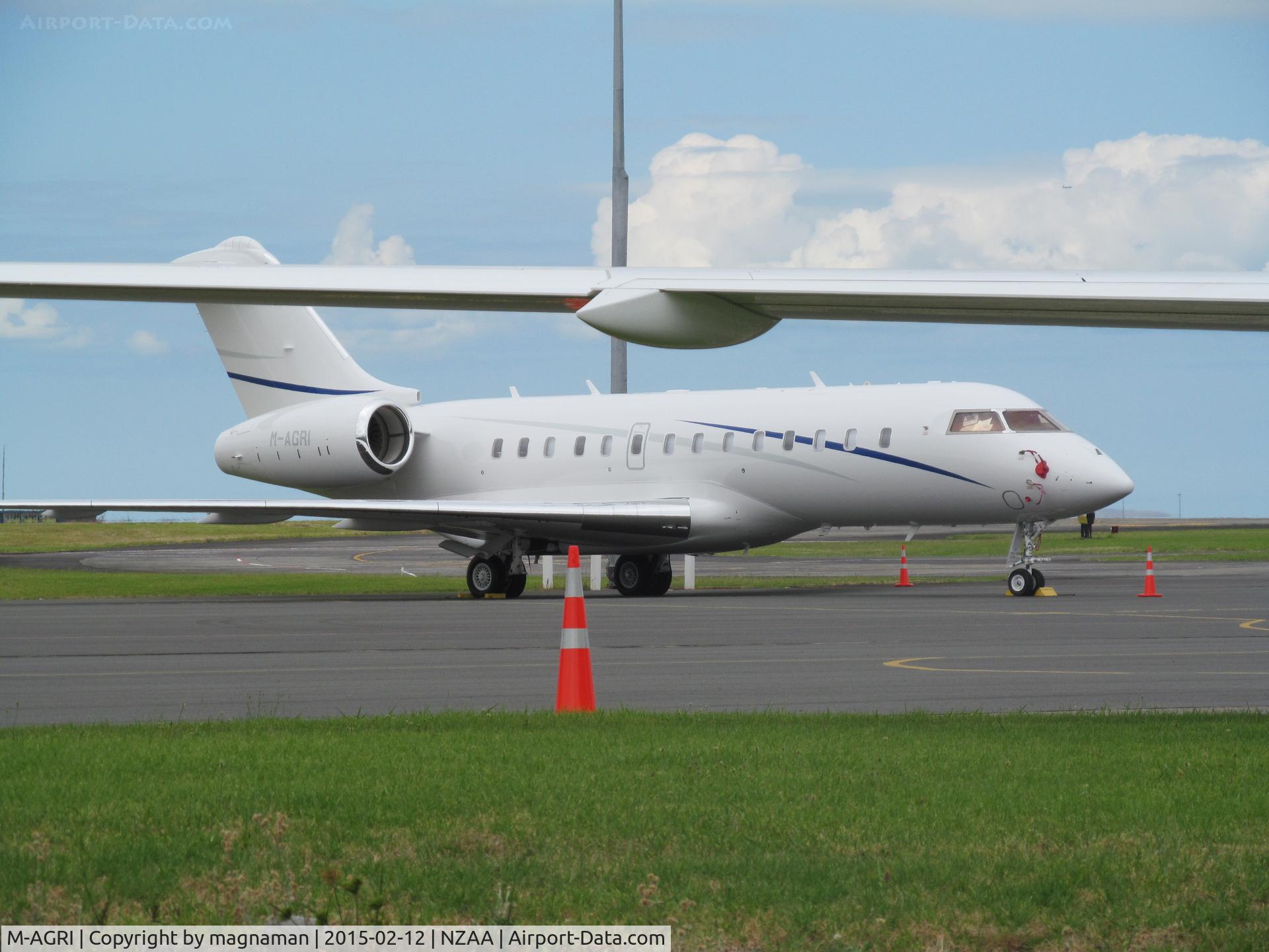 M-AGRI, 2014 Bombardier BD-700-1A11 Global 5000 C/N 9597, Still at AKL (leaves today) seen under wing of M-AAAL