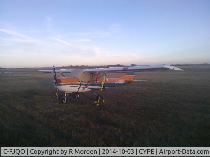 C-FJQO, 1969 Cessna 150J C/N 15070750, Tied down on the infield at CYPE
