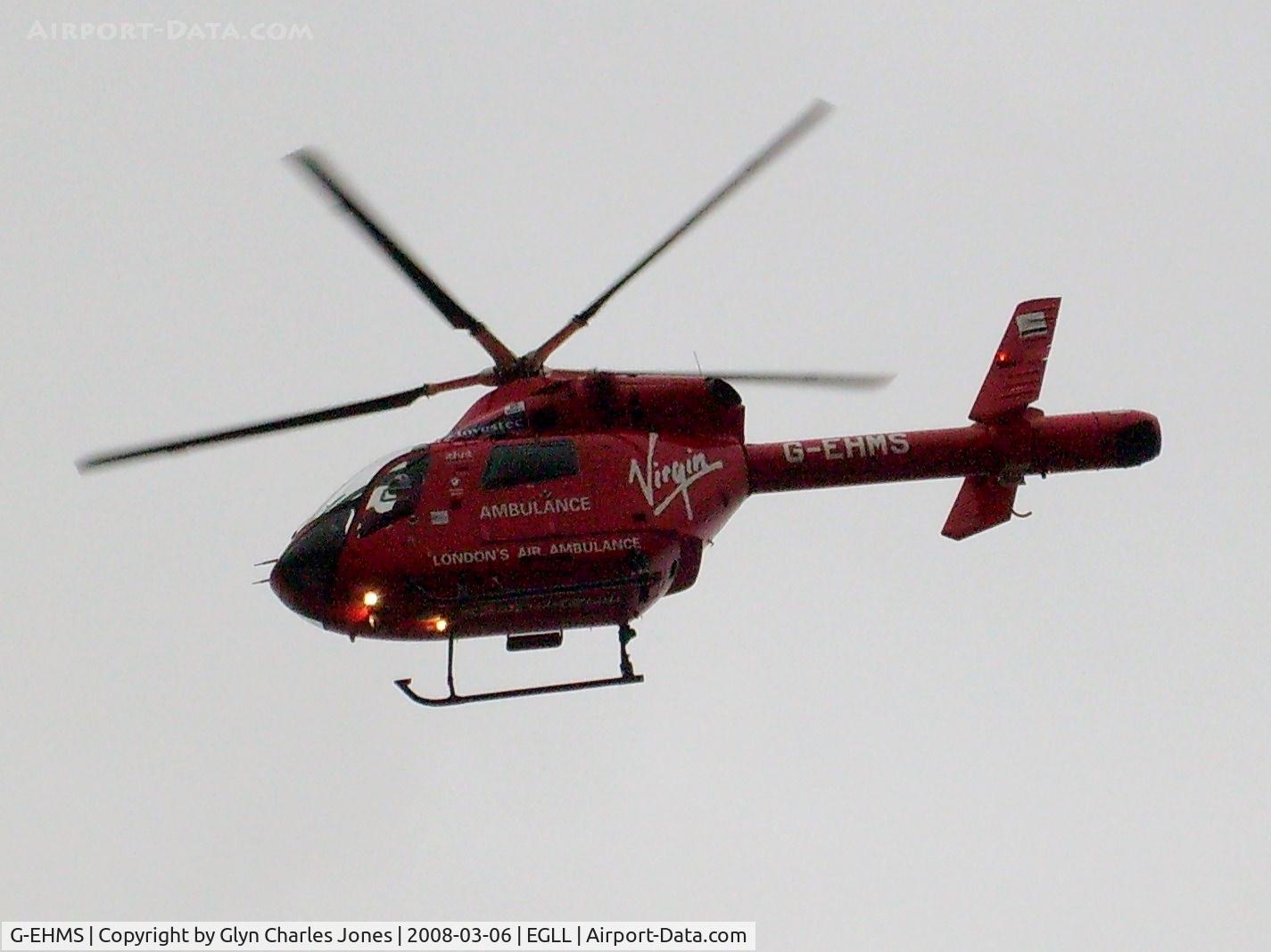 G-EHMS, 2000 McDonnell Douglas MD-902 Explorer C/N 900-00068, Just taken off after attending a road traffic accident on the A30 adjacent to runway 27L at London-Heathrow. Previously N3212K. Owned by London's Air Ambulance Ltd.