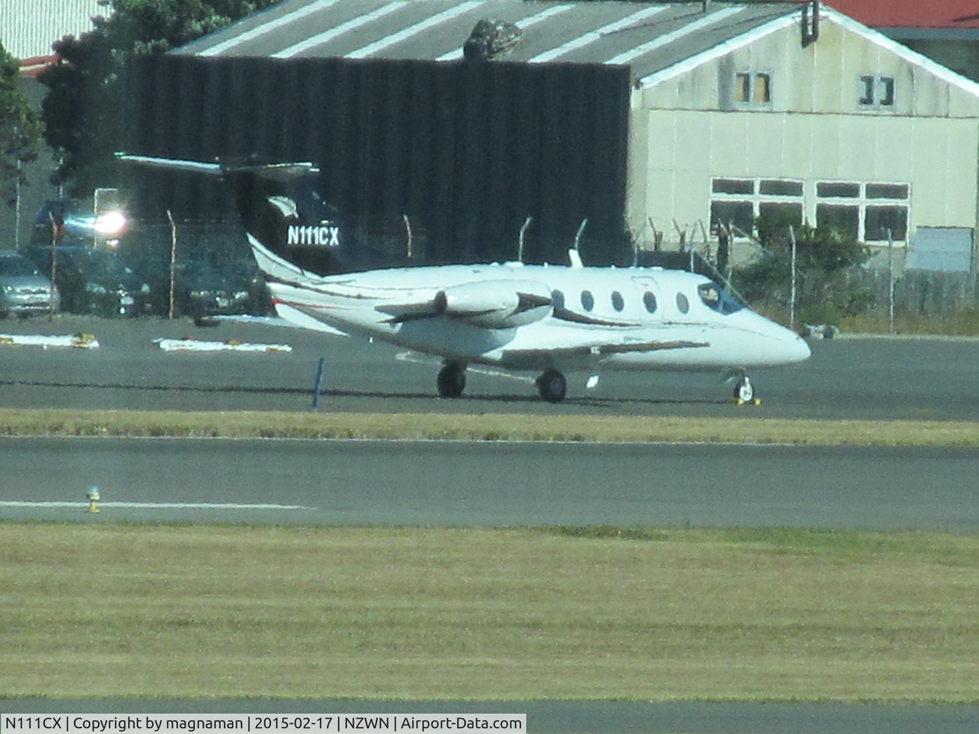 N111CX, 1998 Raytheon Beechjet 400A C/N RK-210, Now branded a Nextant 400txi apparently!! Just delivered to new NZ owners - may become ZK-NXJ - time will tell. Photo is long range from terminal through glass.