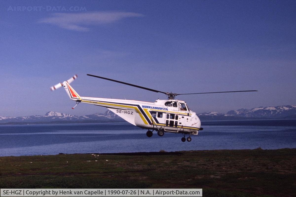 SE-HGZ, 1958 Sikorsky S-55T C/N 55-1252, This Sikorsky S-55T of Norrlandsflyg was used to fly passengers (mainly hikers) in the Padjelanta area of Swedish Lappland. Here it is seen at the village of Staloluokta with lake Virihaure and the mountains along the Norwegian border in the background.