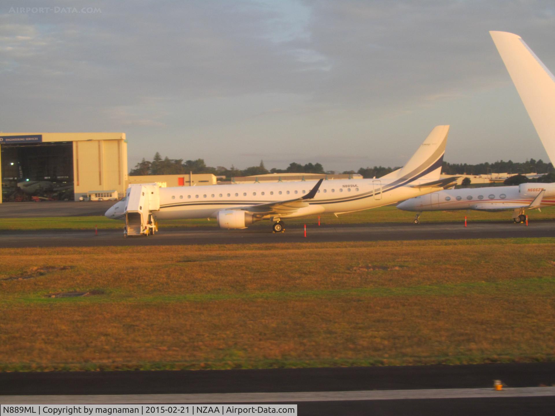 N889ML, Embraer ERJ-190-100ECJ Lineage 1000 C/N 19000438, parked on taxiway as I went by inside ZK-PBI