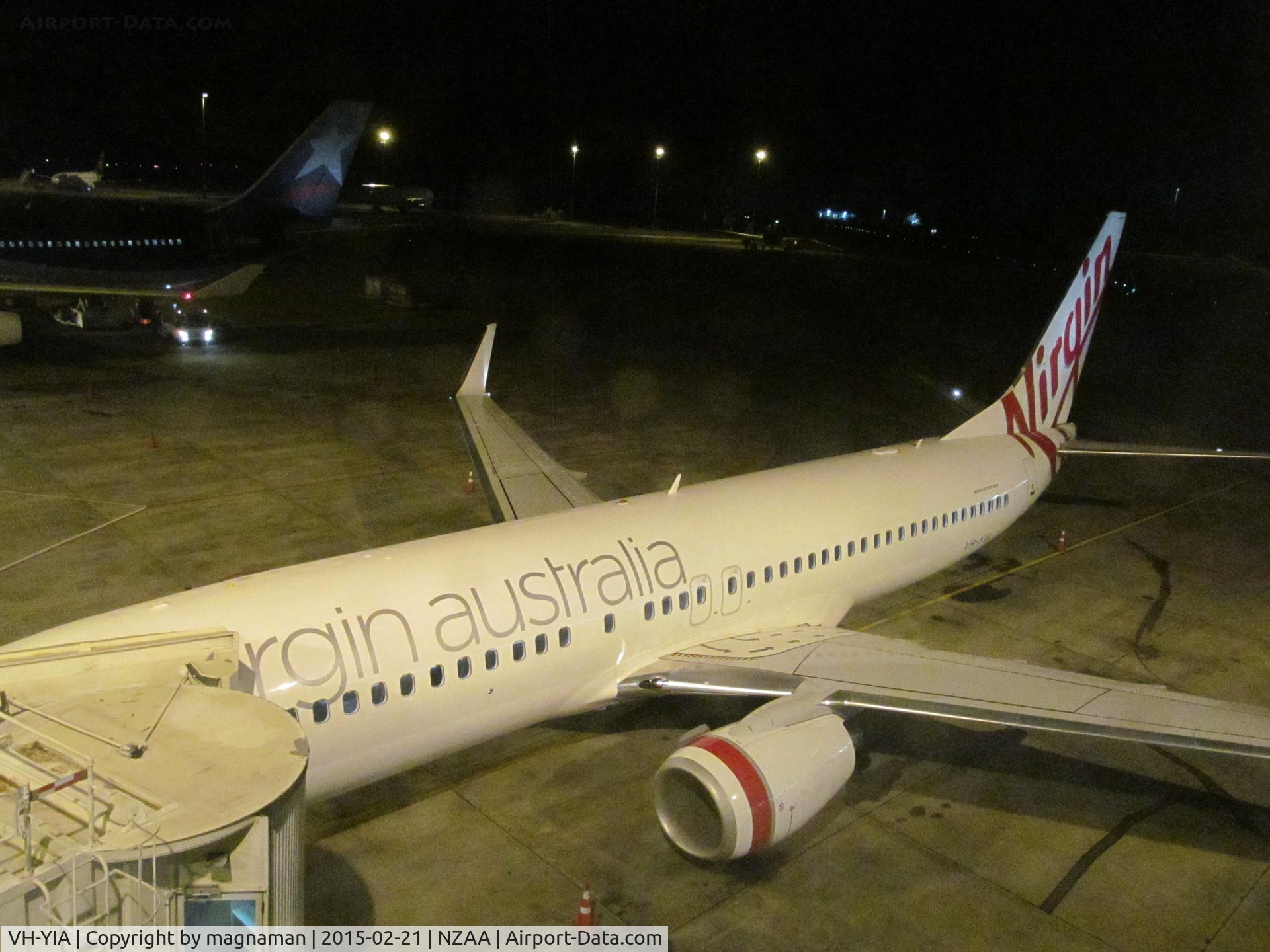 VH-YIA, 2011 Boeing 737-8FE C/N 37824, in dark at AKL as I walk down to departure gate 16